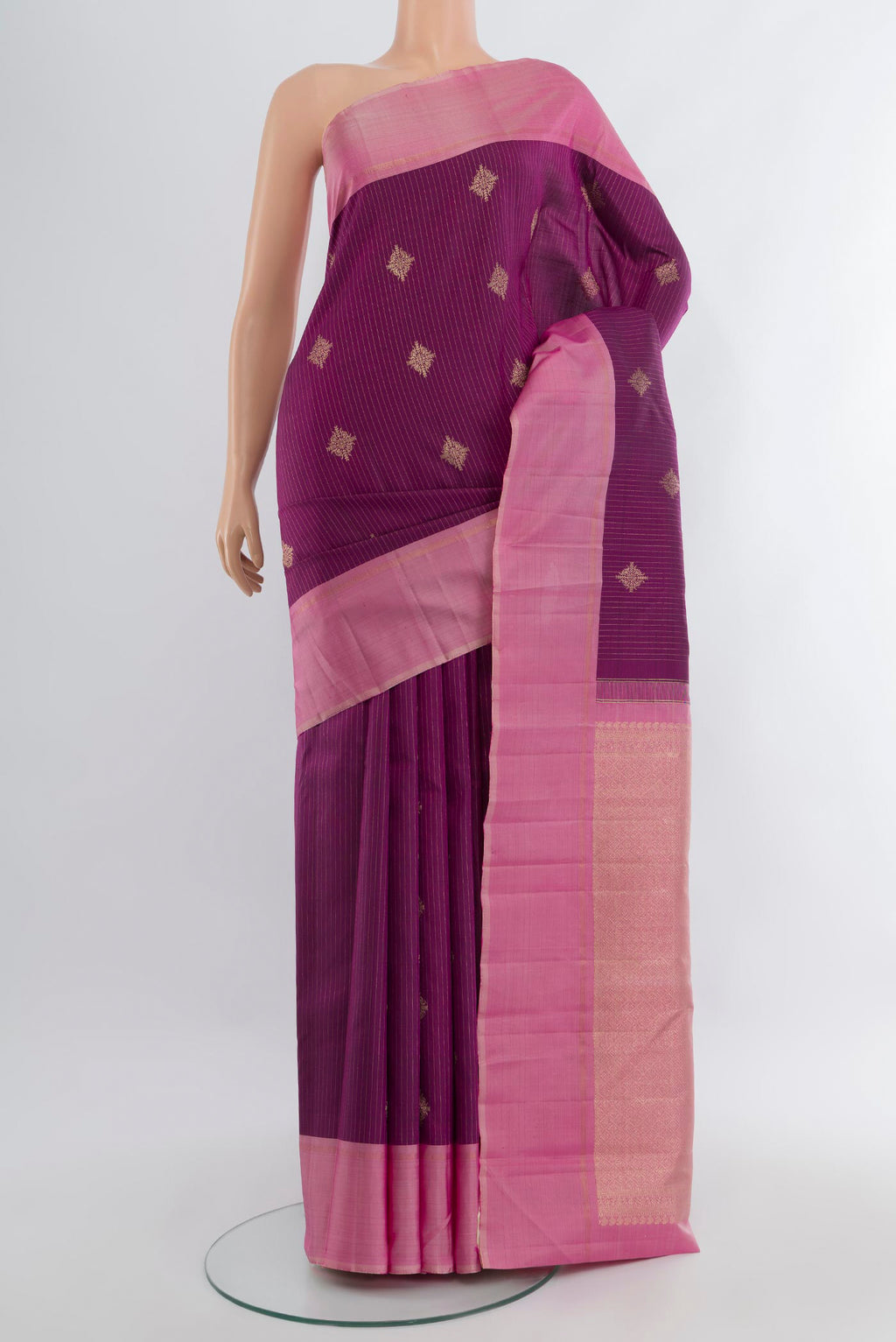 Purple Kanjivaram Silk Saree with Zari Butta on the body and Plain Border.  displayed on a mannequin