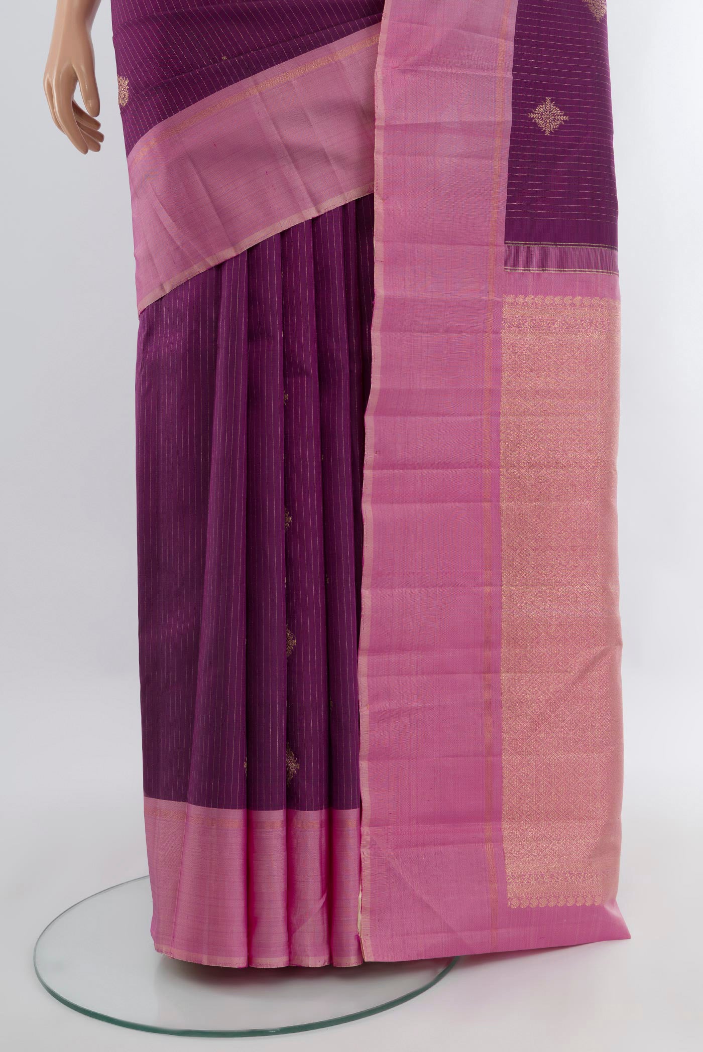 Pleats and pallu of Purple Kanjivaram Silk Saree with Zari Butta on the body and Plain Border. 