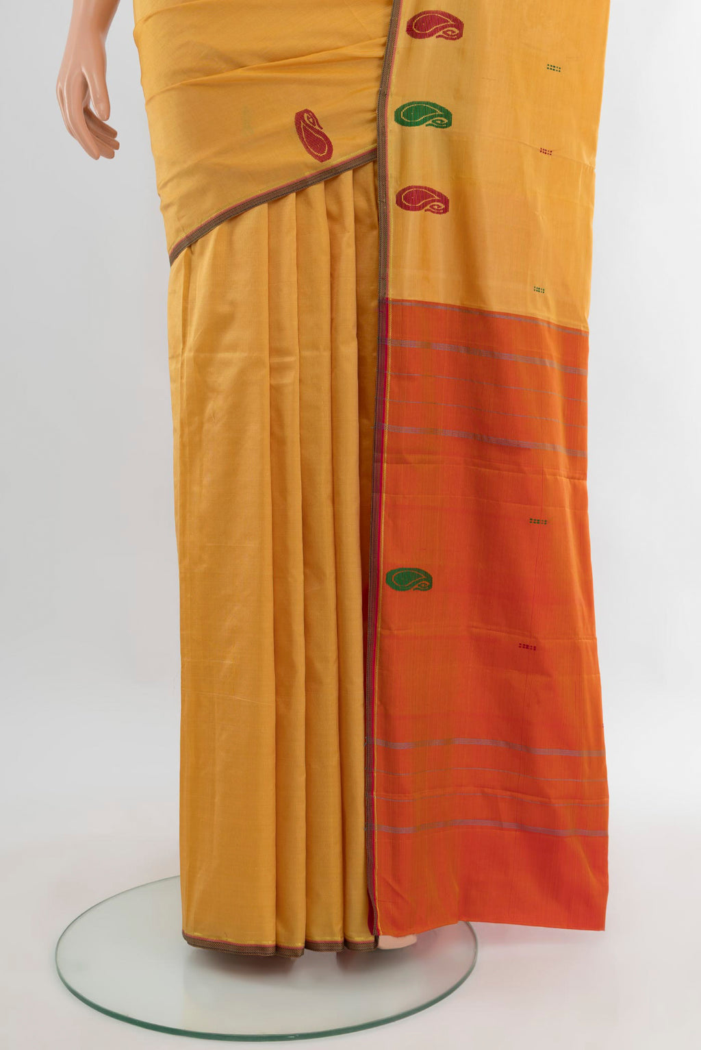 Pleats and pallu of Sandal Kanchipuram Silk Saree with Plain Body and Thread Border. 