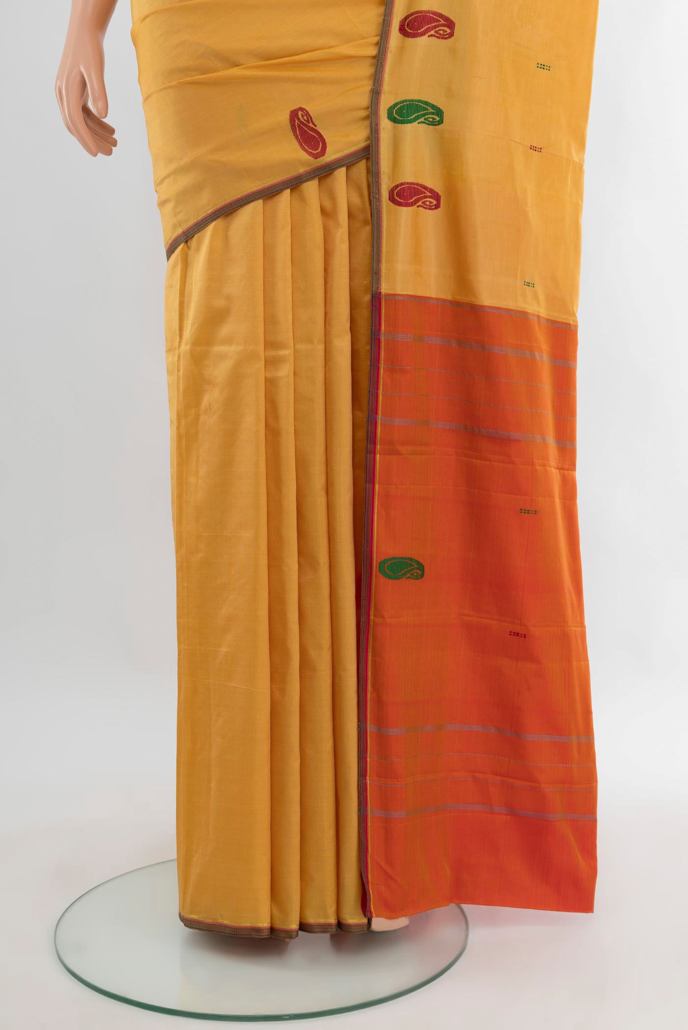 Pleats and pallu of Sandal Kanchipuram Silk Saree with Plain Body and Thread Border. 
