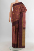 Pure Silk Bronze Kanjivaram Saree with Zari Butta on the body and Zari Border.  displayed on a mannequin