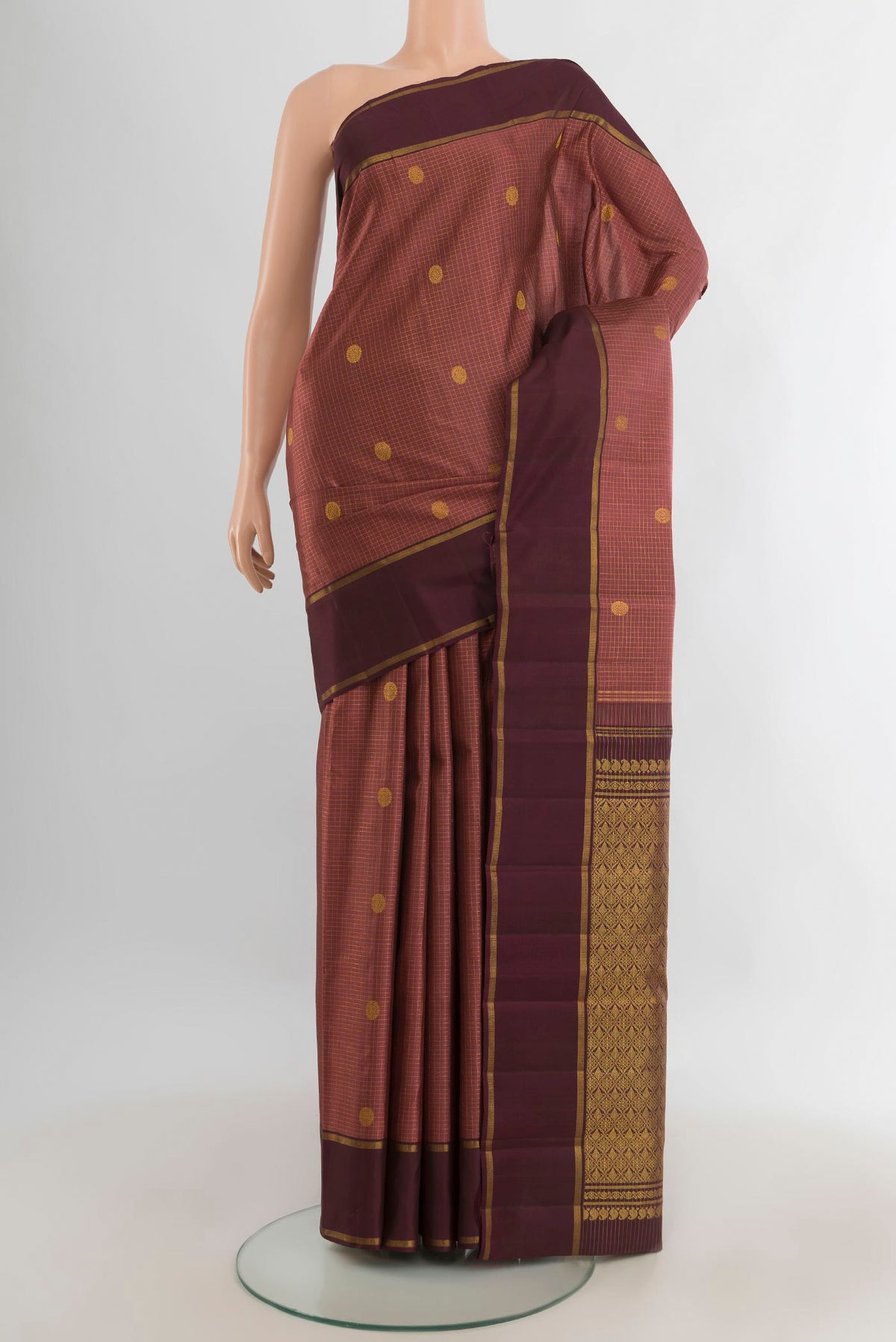 Pure Silk Bronze Kanjivaram Saree with Zari Butta on the body and Zari Border.  displayed on a mannequin