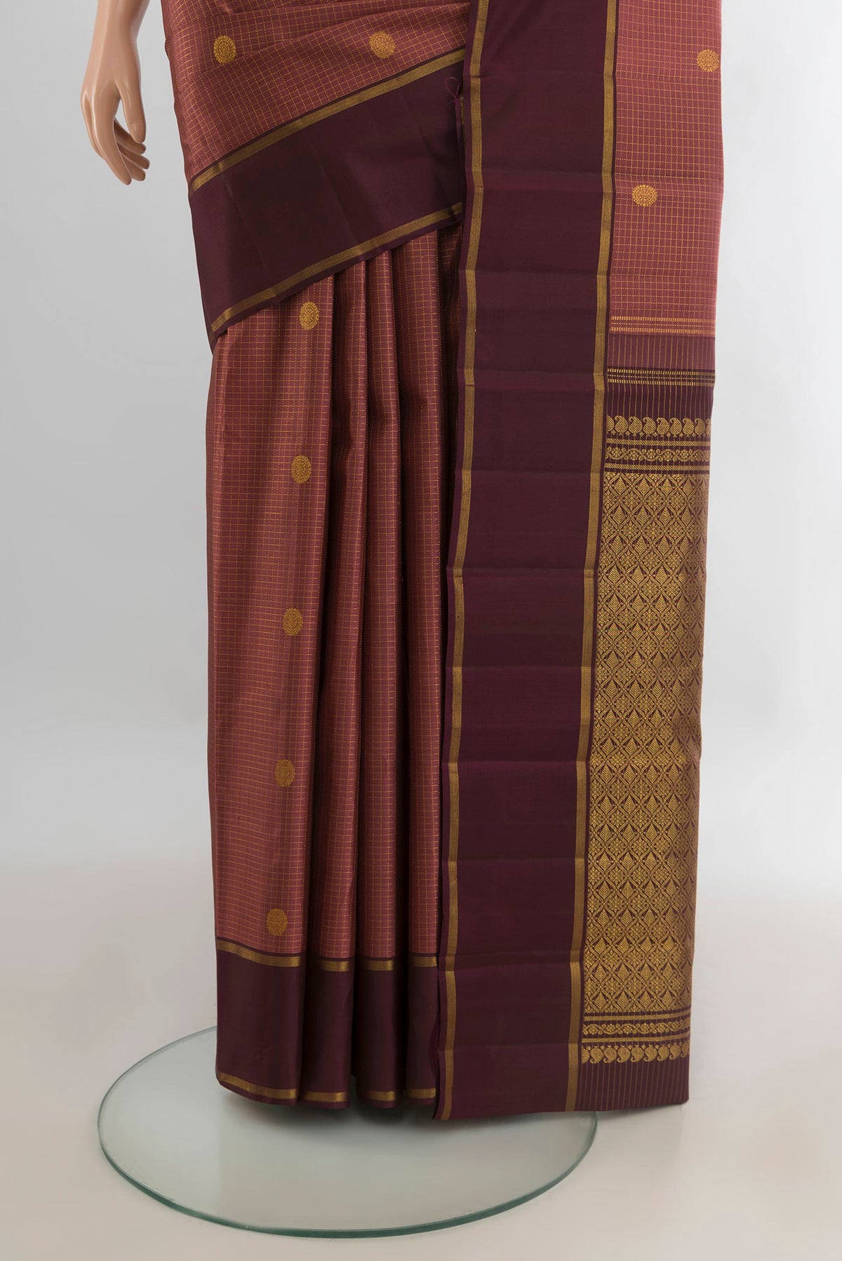 Pleats and pallu of Pure Silk Bronze Kanjivaram Saree with Zari Butta on the body and Zari Border. 