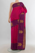 Pure Silk Pure Zari Dark Pink Kanjivaram Saree with Zari Butta on the body and Silk Border.  displayed on a mannequin