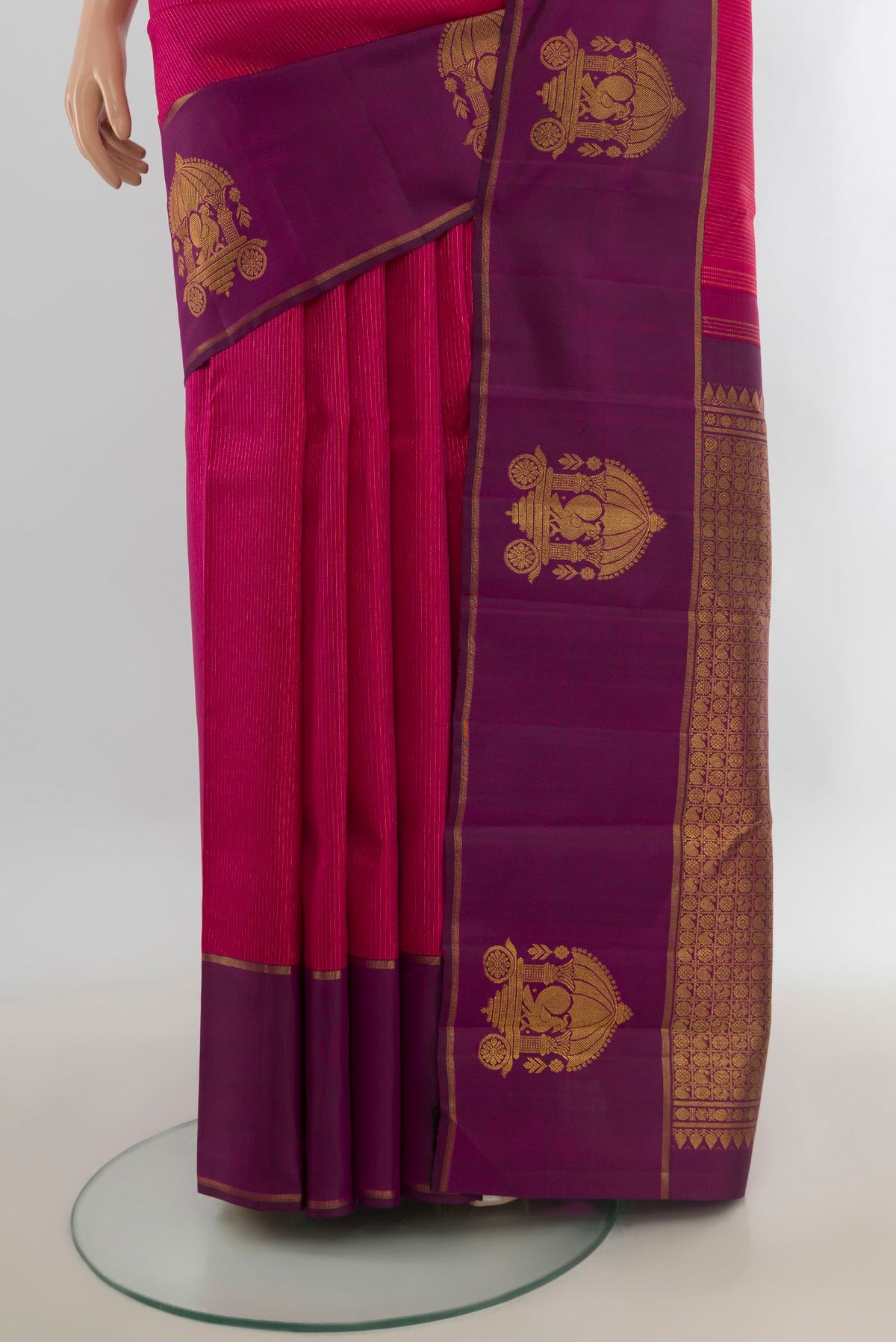 Pleats and pallu of Pure Silk Pure Zari Dark Pink Kanjivaram Saree with Zari Butta on the body and Silk Border. 