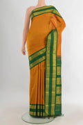 Pure Silk Mustard Kanjivaram Saree with Plain Body and Zari Border.  displayed on a mannequin