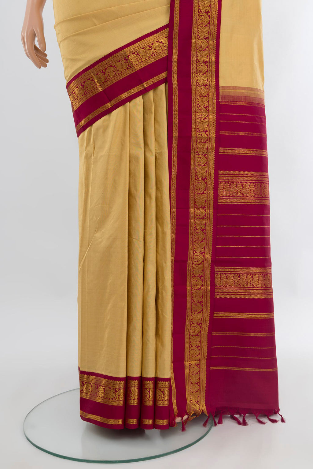 Pleats and pallu of Sandal Kanjivaram Silk Saree with Plain Body and Zari Border. 