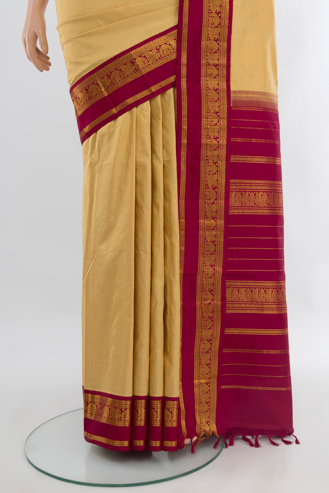 Pleats and pallu of Sandal Kanjivaram Silk Saree with Plain Body and Zari Border. 