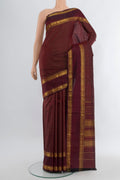 Maroon Kanjivaram Silk Saree with Checked design on the body and Zari Border.  displayed on a mannequin