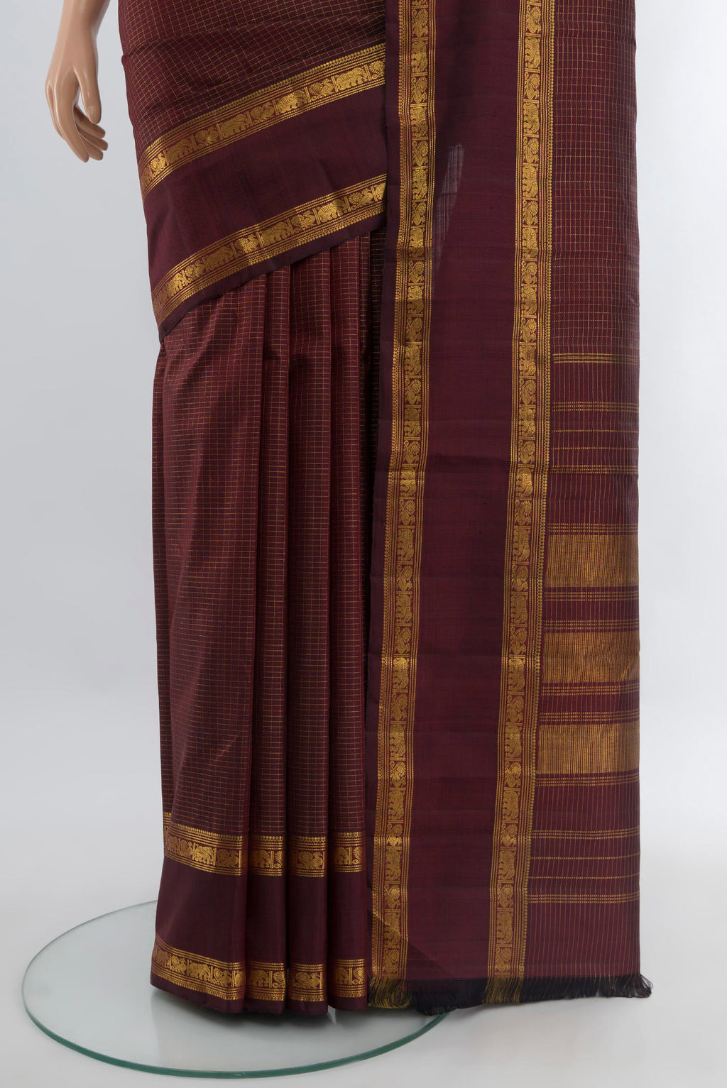 Pleats and pallu of Maroon Kanjivaram Silk Saree with Checked design on the body and Zari Border. 