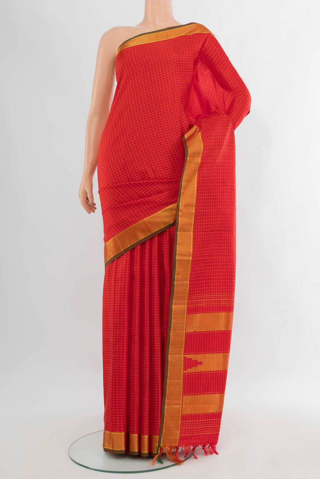 Red Kanchipuram Silk Saree with Checked design on the body and Zari Border.  displayed on a mannequin