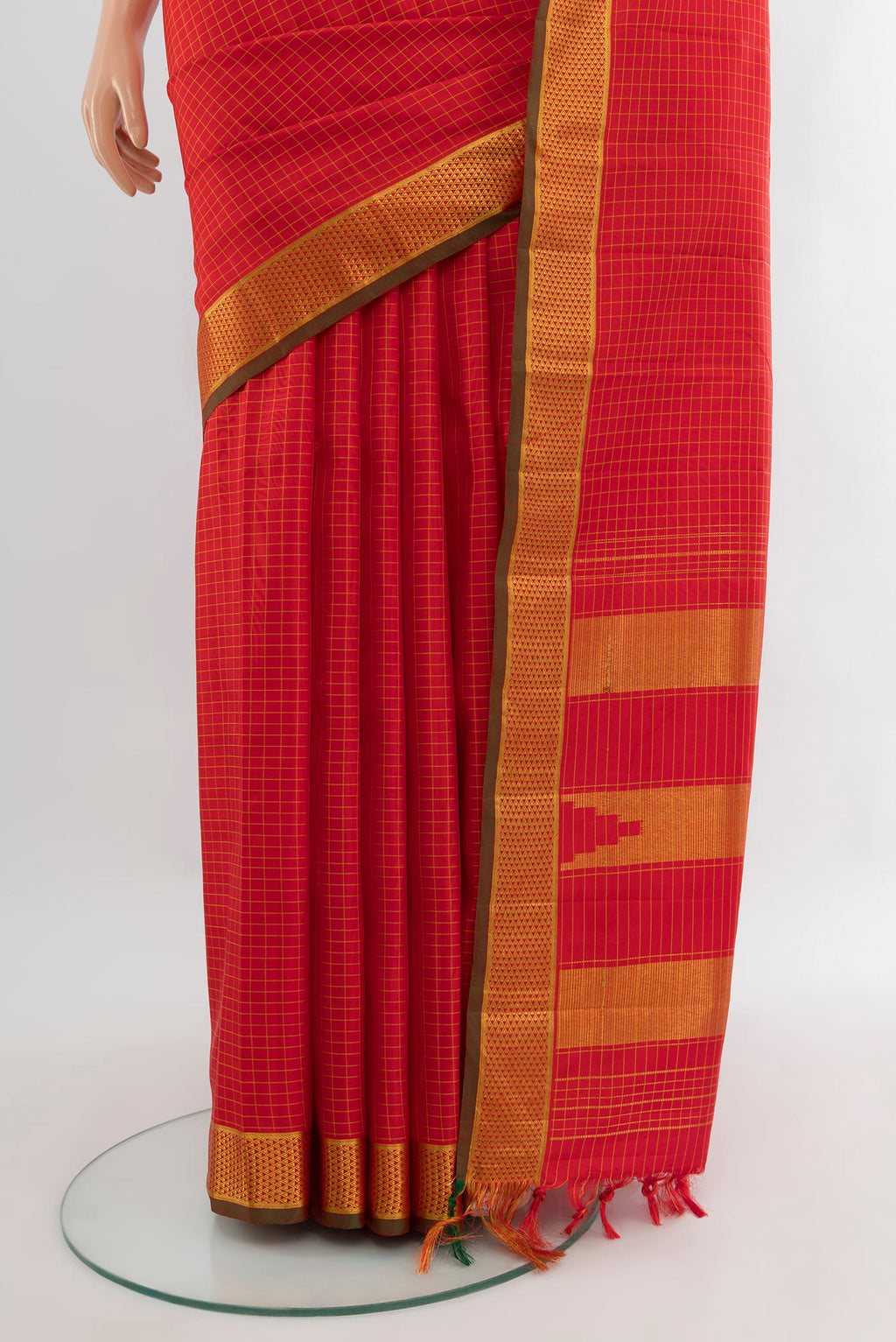 Pleats and pallu of Red Kanchipuram Silk Saree with Checked design on the body and Zari Border. 