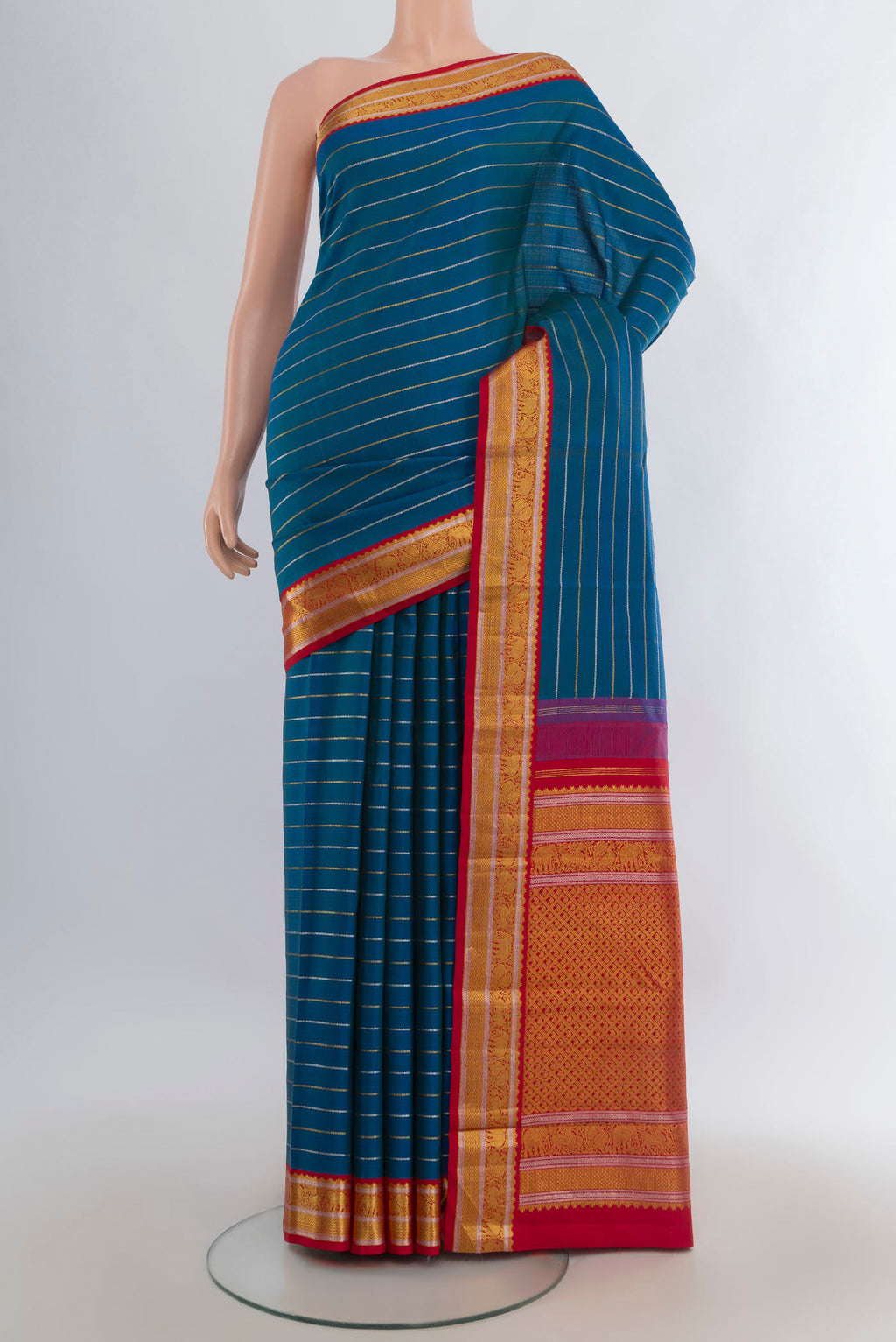 Pure Silk Peacock Blue Kanjivaram Saree with Stripes on the body and Zari Border.  displayed on a mannequin
