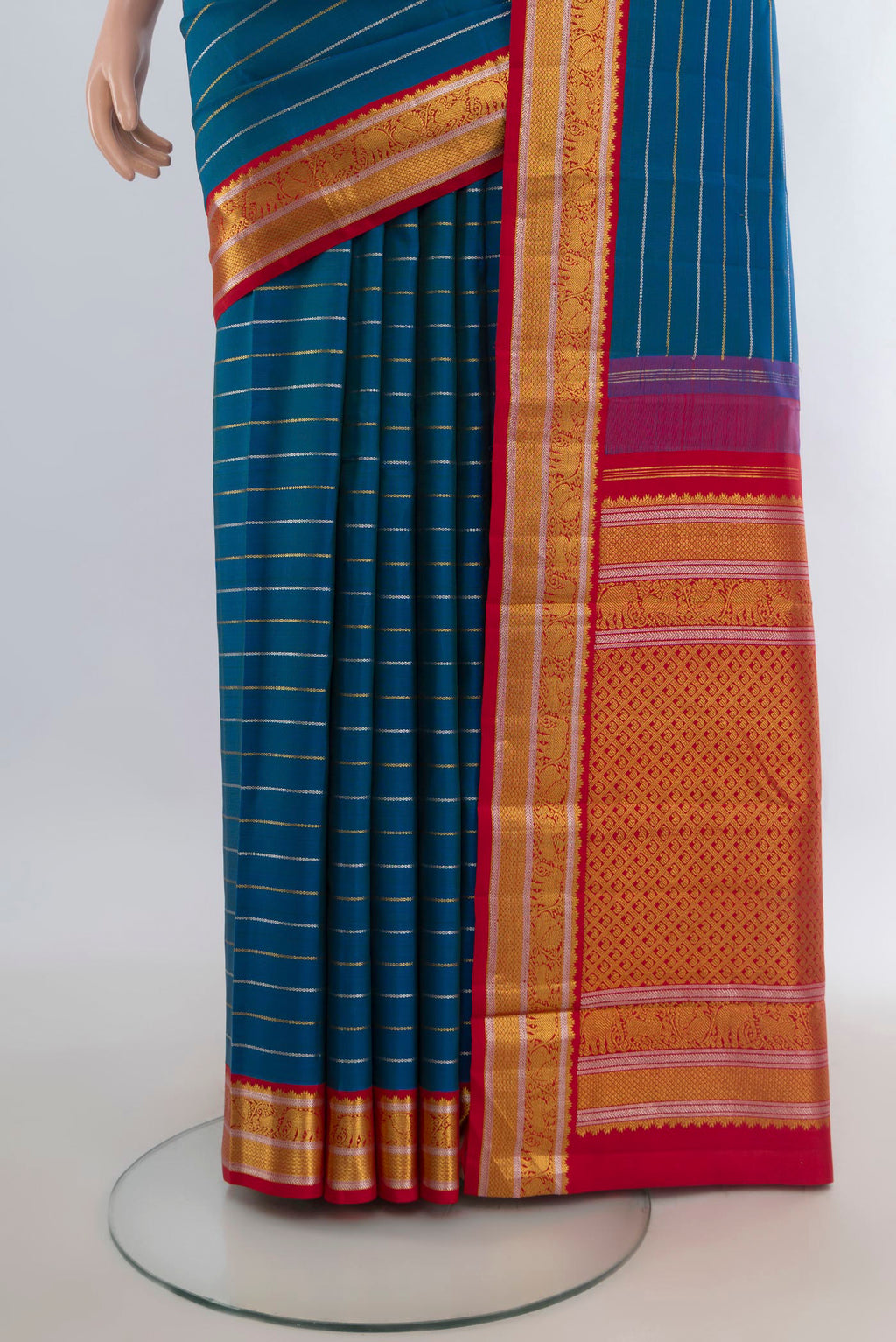 Pleats and pallu of Pure Silk Peacock Blue Kanjivaram Saree with Stripes on the body and Zari Border. 