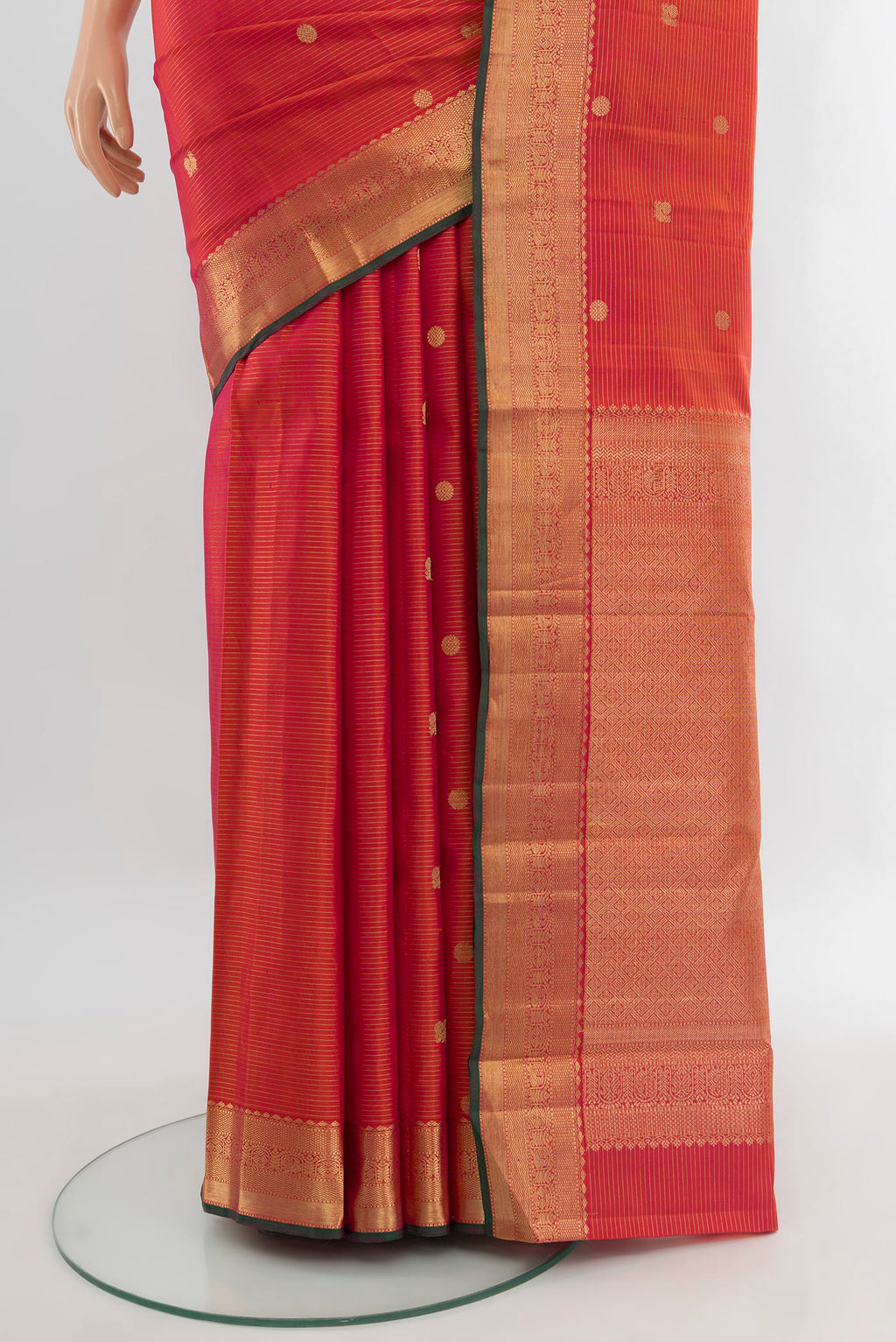 Pleats and pallu of Orange with Pink Color Kanjivaram Silk Saree with Zari Butta on the body and Zari Border. 
