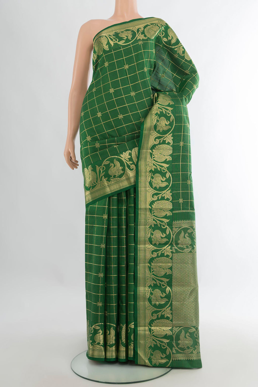 Pure Silk Green Kanchipuram Saree with Checked design on the body and Fancy Border.  displayed on a mannequin