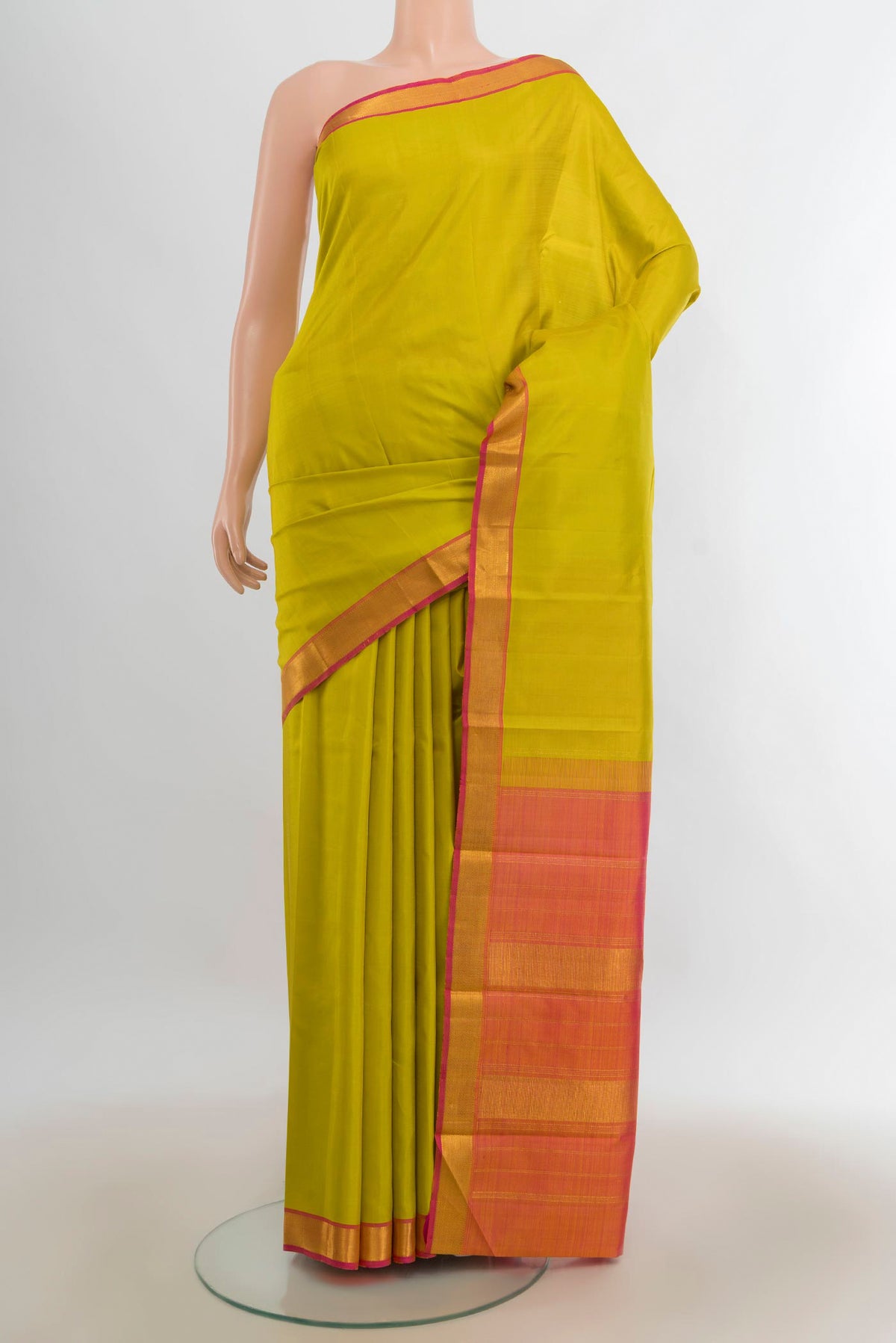 Pure Silk Pure Zari Light Green Kanjivaram Saree with Plain Body and Silk Border.  displayed on a mannequin