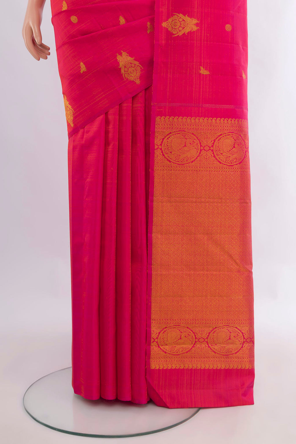 Pleats and pallu of Pure Silk Pink Kanchipuram Saree with Zari Butta on the body and Without Border. 