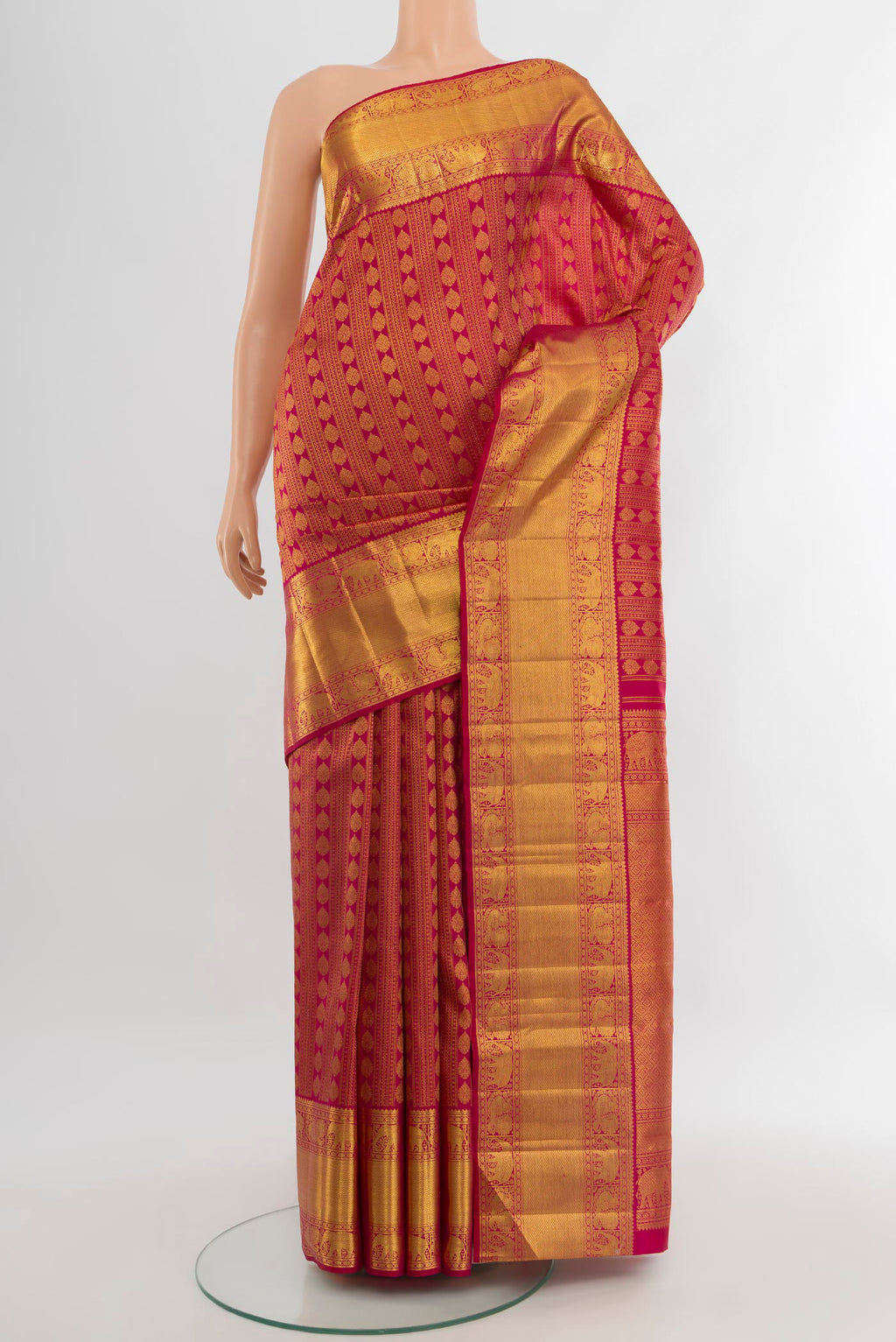 Dark Pink Kanchipuram Silk Saree with Zari Brocade on the body and Zari Border.  displayed on a mannequin