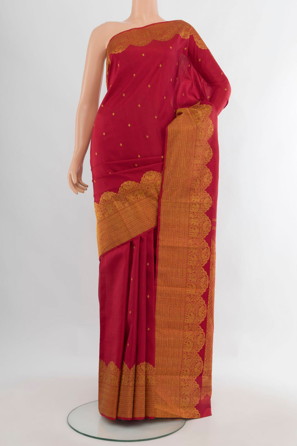 Pure Silk Maroon Kanchipuram Saree with Zari Butta on the body and Fancy Border.  displayed on a mannequin