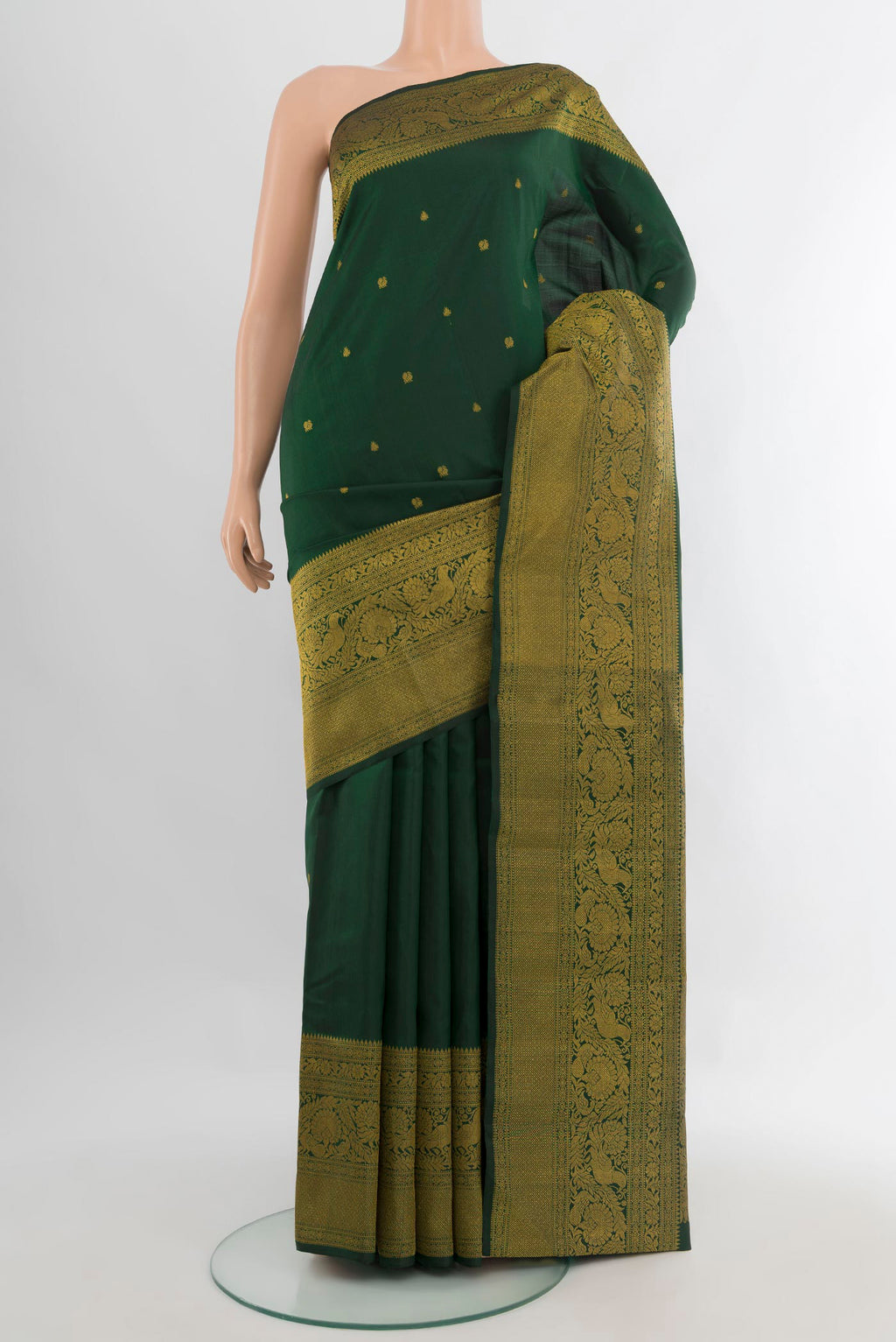 Pure Silk Bottle Green Kanchipuram Saree with Zari Butta on the body and Fancy Border.  displayed on a mannequin