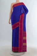 Pure Silk Royal Blue Kanjivaram Saree with Plain Body and Plain Border.  displayed on a mannequin