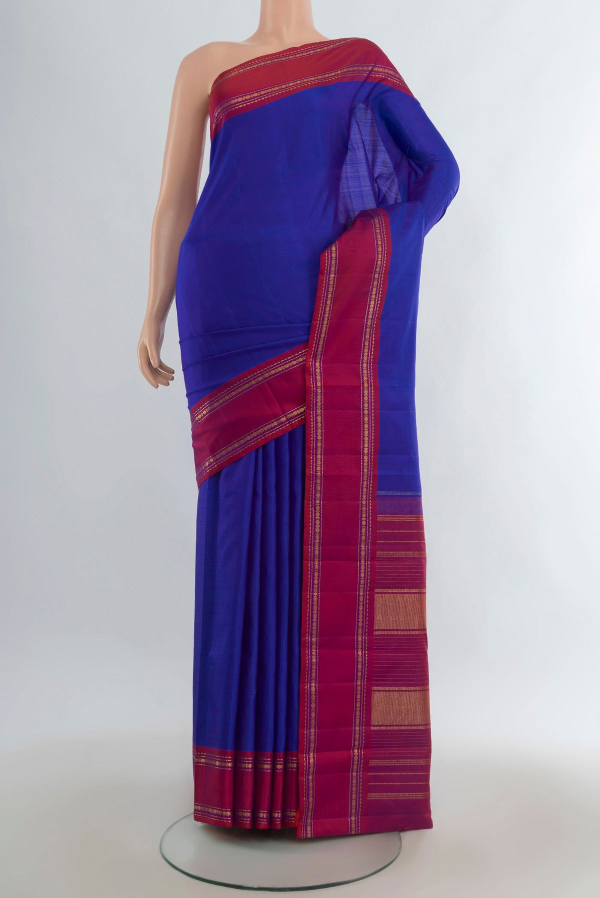 Pure Silk Royal Blue Kanjivaram Saree with Plain Body and Plain Border.  displayed on a mannequin