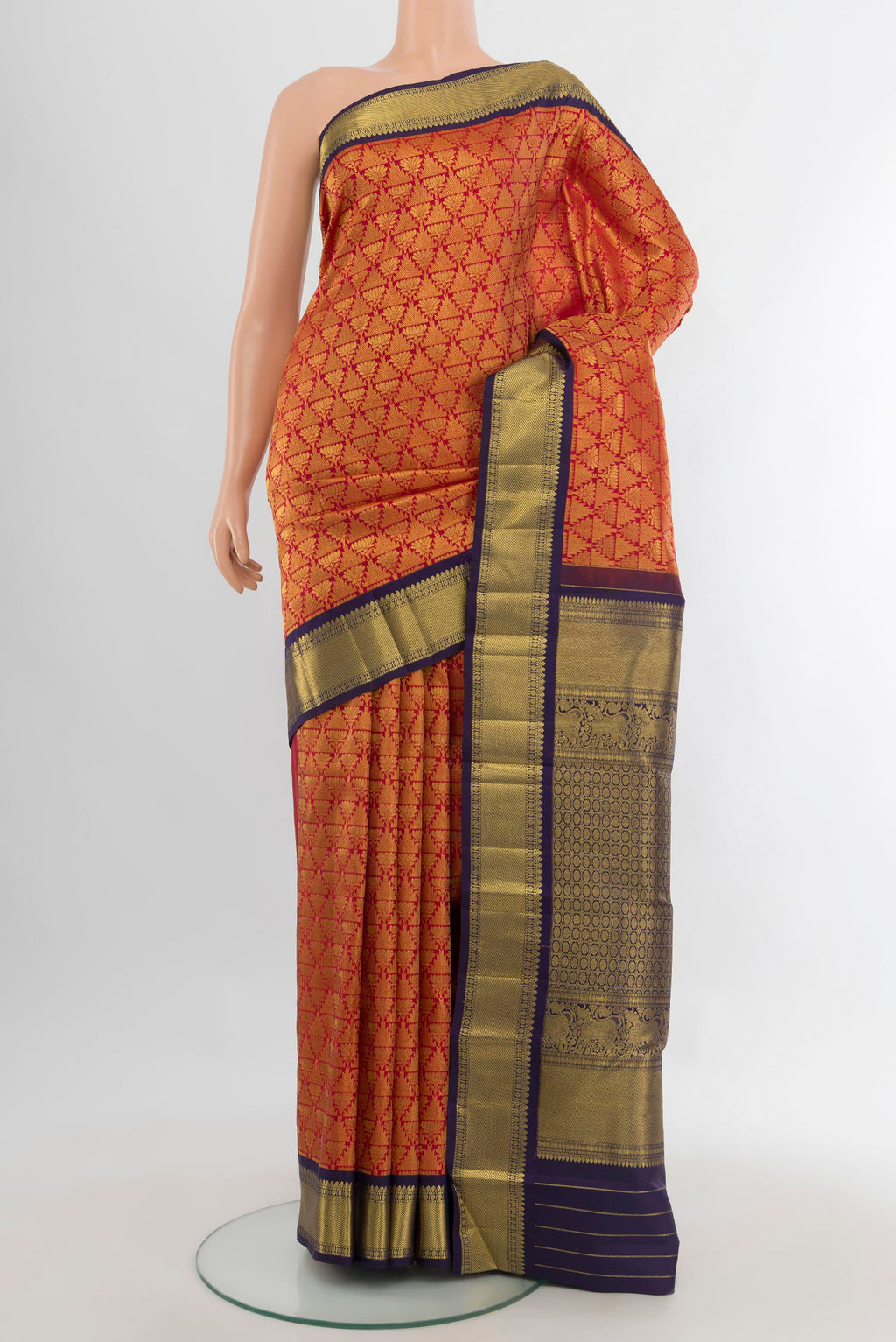 Pure Silk Red Kanchipuram Saree with Zari Brocade on the body and Zari Border.  displayed on a mannequin