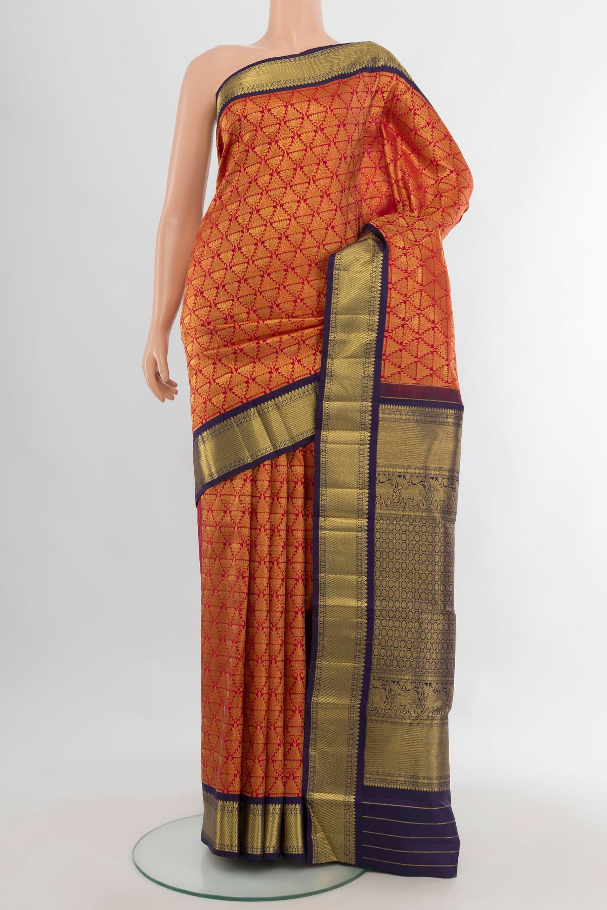 Pure Silk Red Kanchipuram Saree with Zari Brocade on the body and Zari Border.  displayed on a mannequin