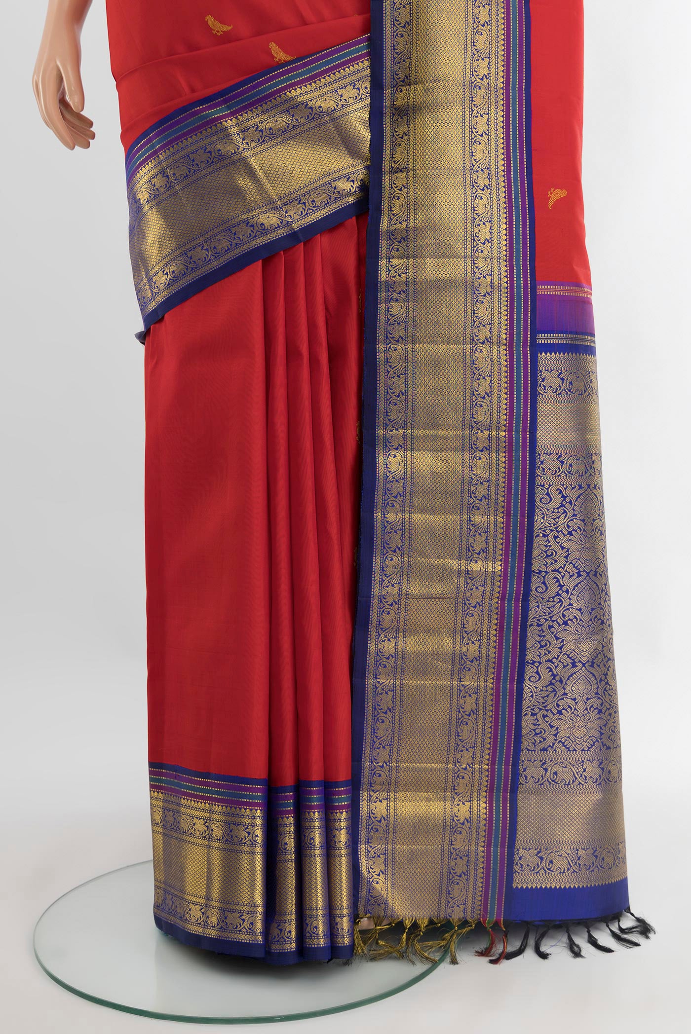 Pleats and pallu of Pure Silk Pure Zari Red Kanchipuram Saree with Zari Butta on the body and Zari Border. 