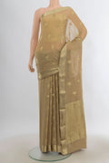 Beige Mysore Georgette Saree with Zari Butta on the body and Zari Border.  displayed on a mannequin