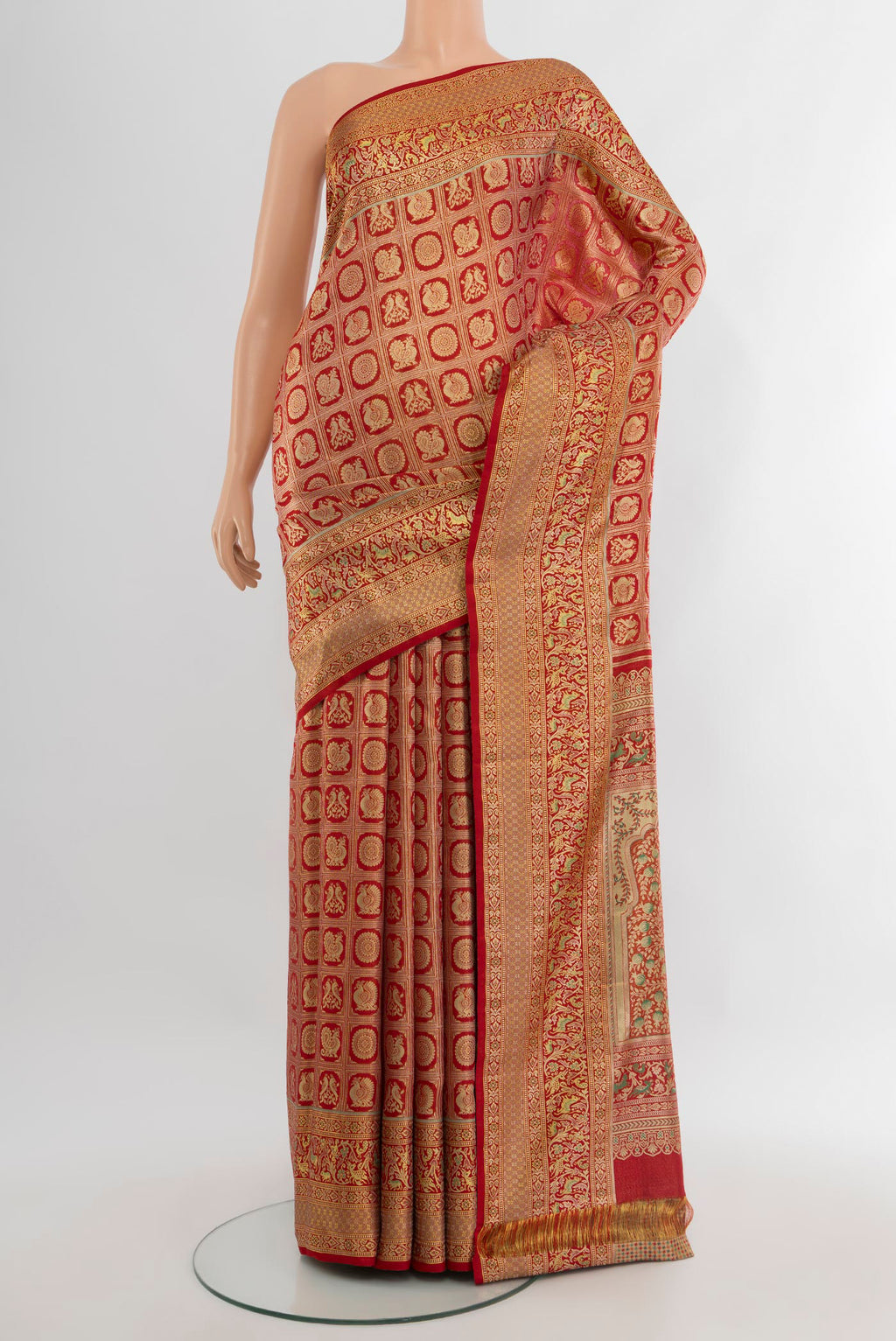 Red Kanchipuram Tissue Silk Saree with Zari Brocade on the body and Zari Border.  displayed on a mannequin