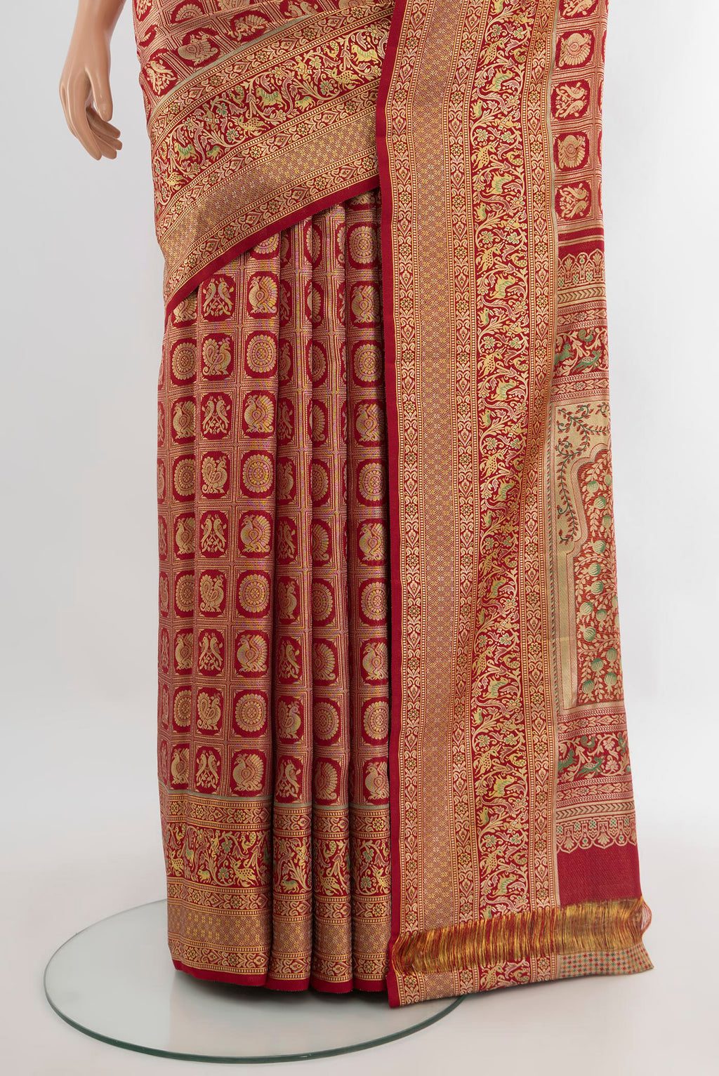 Pleats and pallu of Red Kanchipuram Tissue Silk Saree with Zari Brocade on the body and Zari Border. 