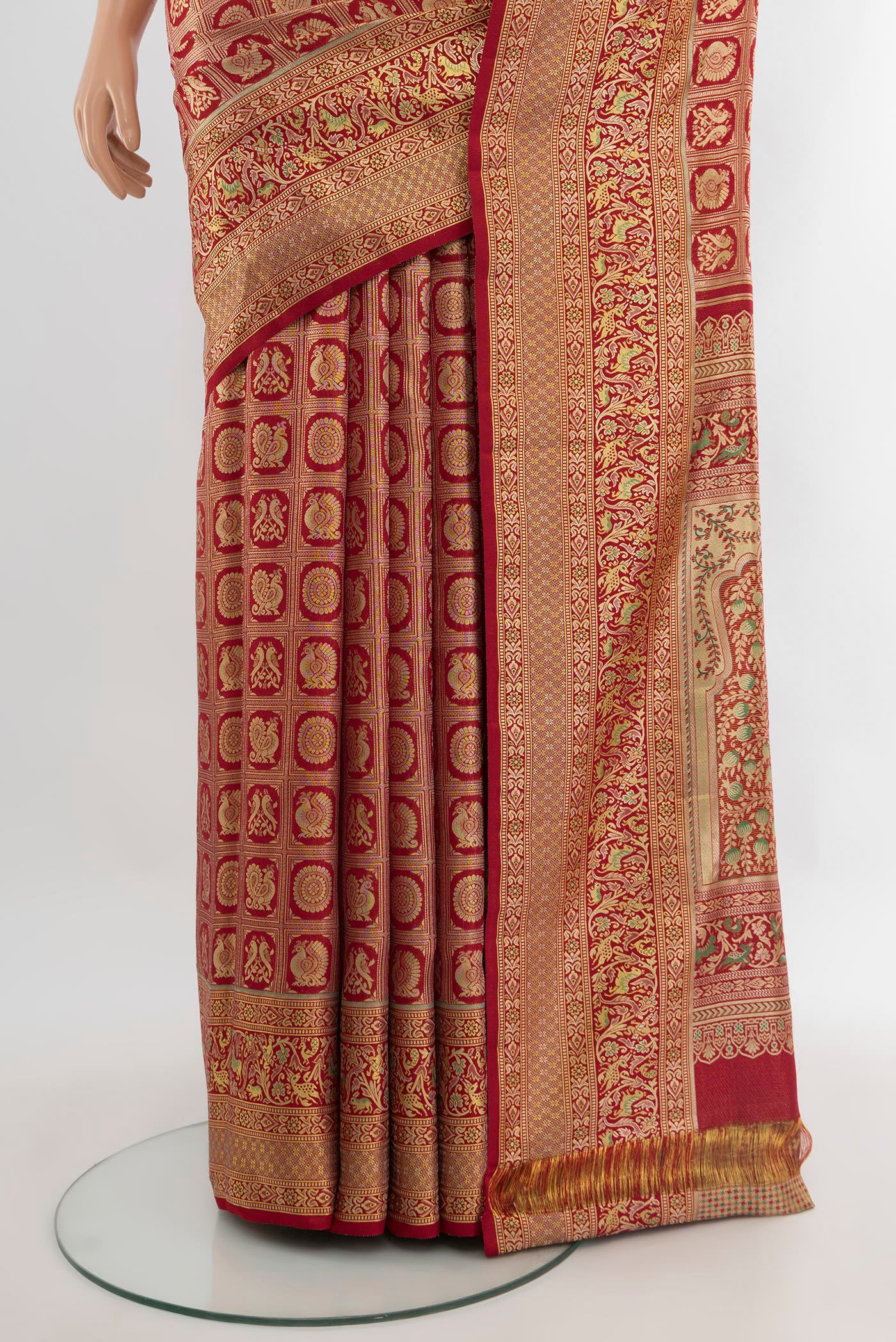 Pleats and pallu of Red Kanchipuram Tissue Silk Saree with Zari Brocade on the body and Zari Border. 