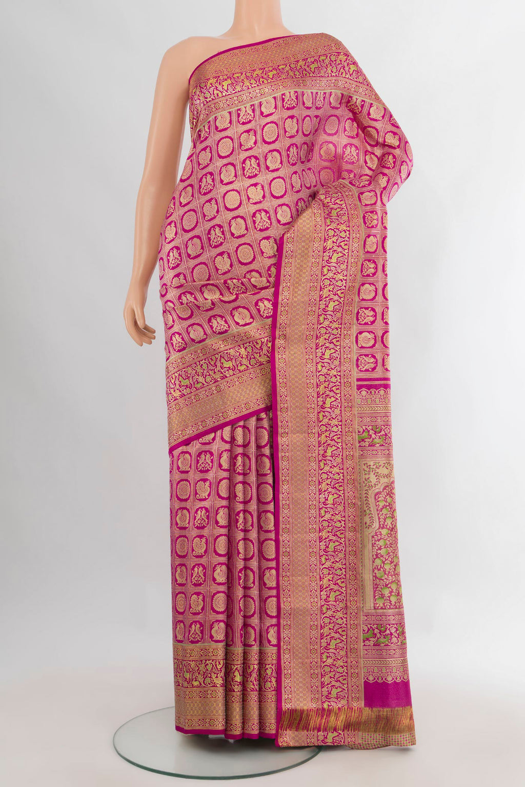 Pure Silk Dark Pink Kanchipuram Saree with Zari Brocade on the body and Zari Border.  displayed on a mannequin