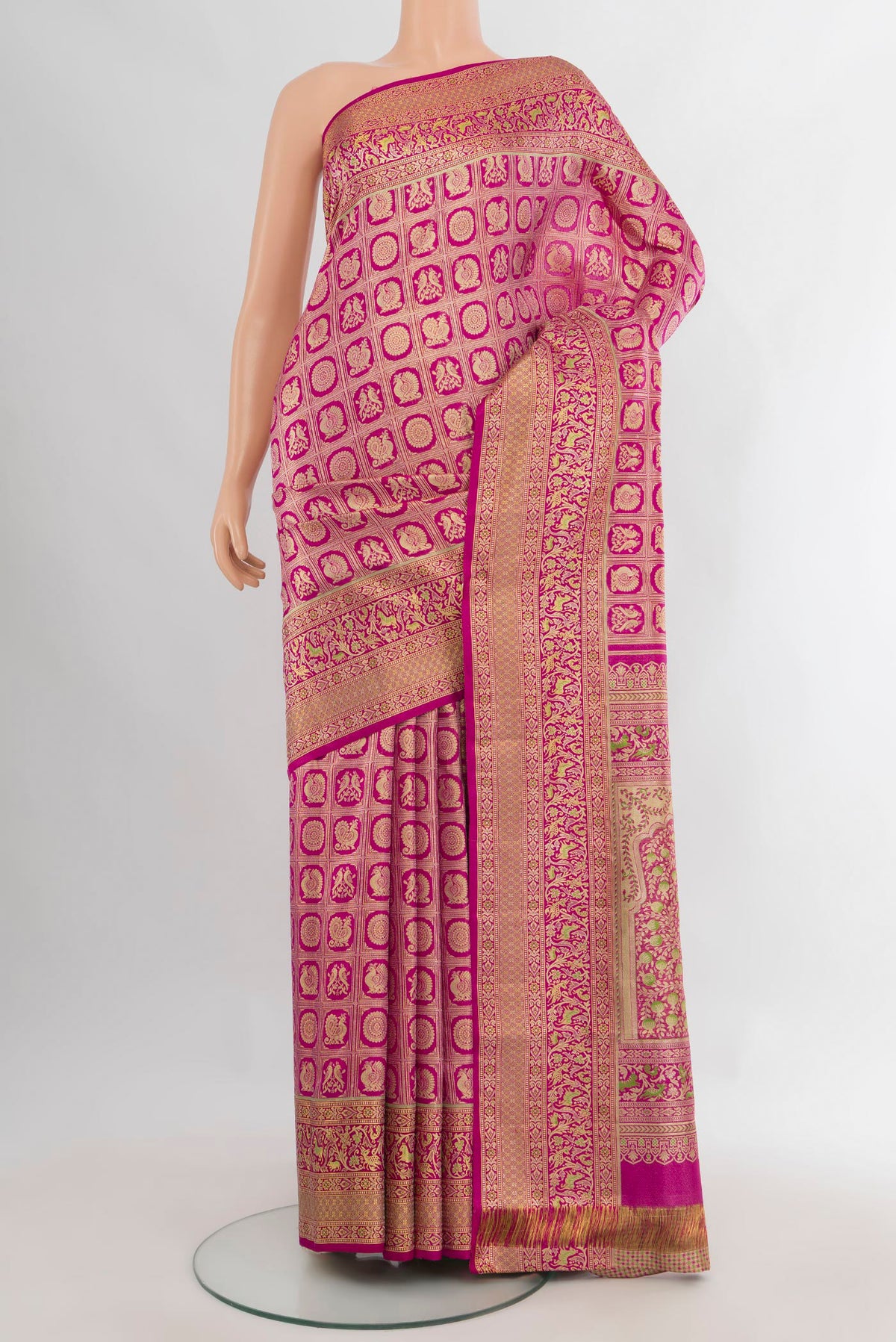 Pure Silk Dark Pink Kanchipuram Saree with Zari Brocade on the body and Zari Border.  displayed on a mannequin