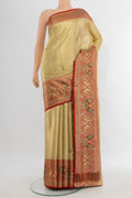 Golden Kanchipuram Tissue Silk Saree with Zari Brocade on the body and Zari Border.  displayed on a mannequin