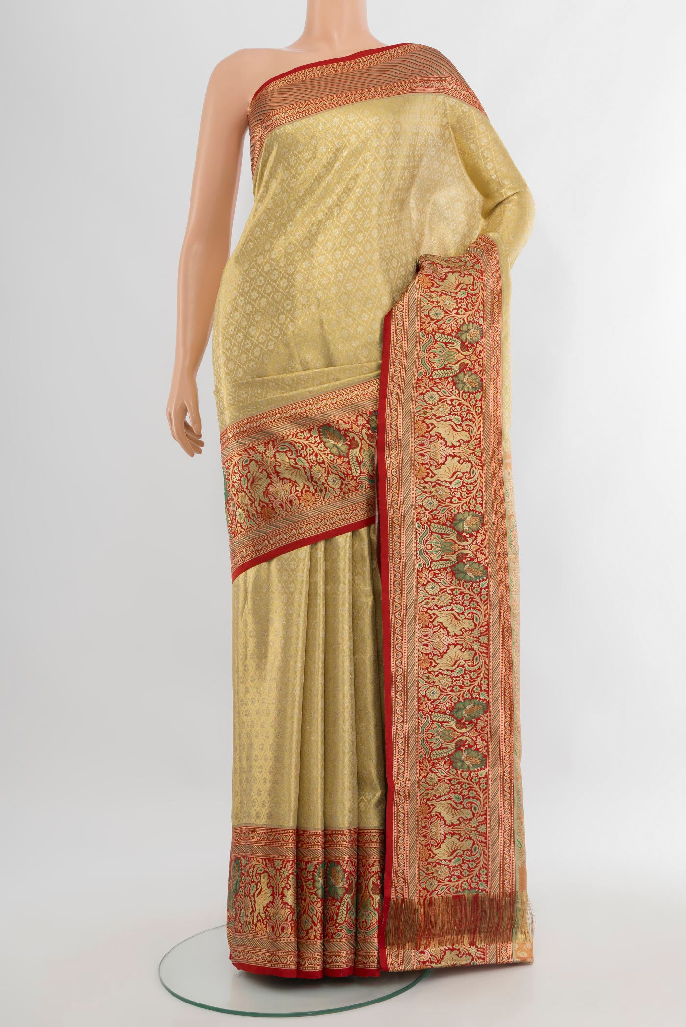 Golden Kanchipuram Tissue Silk Saree with Zari Brocade on the body and Zari Border.  displayed on a mannequin