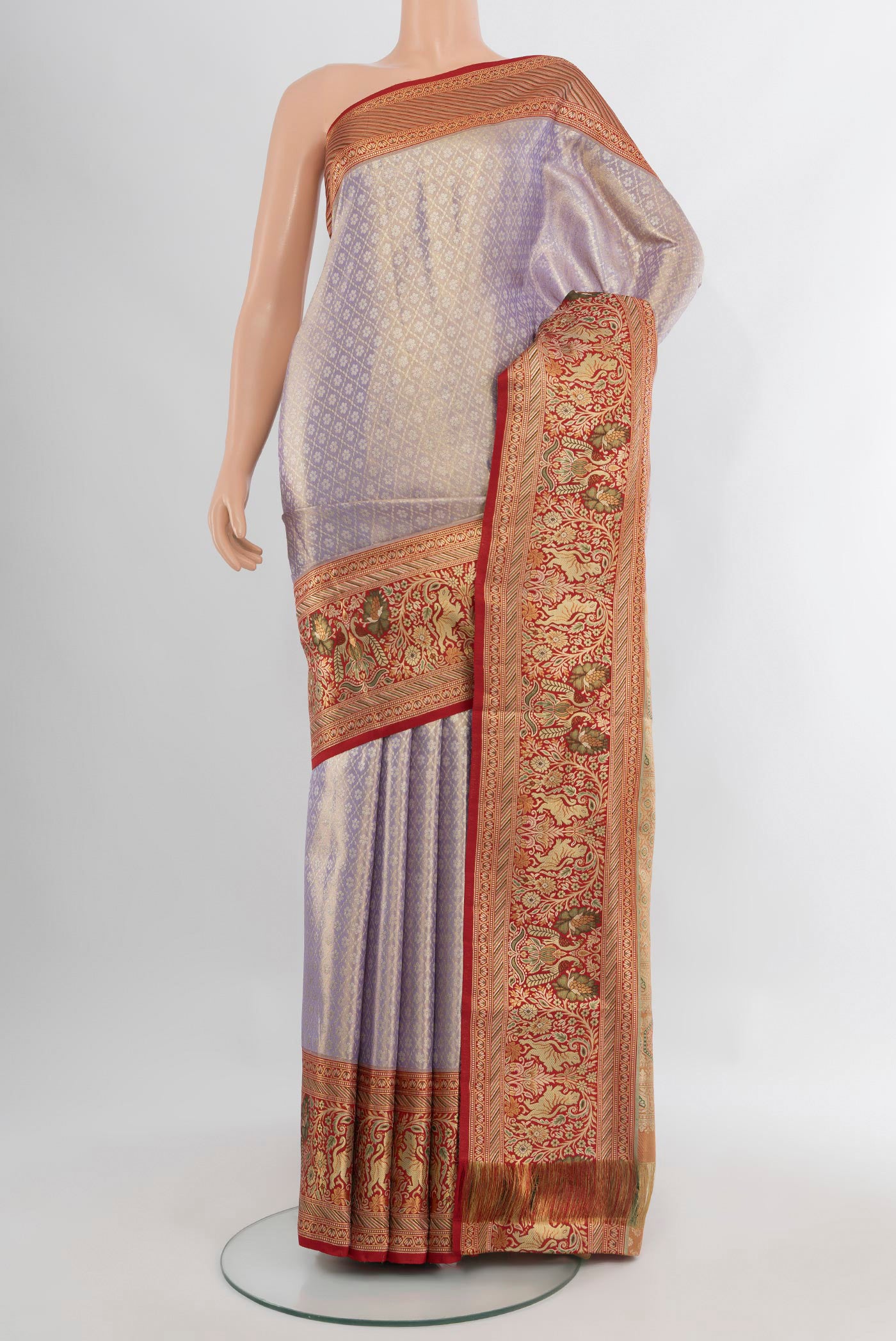 Lavender Kanchipuram Tissue Silk Saree with Zari Brocade on the body and Zari Border.  displayed on a mannequin