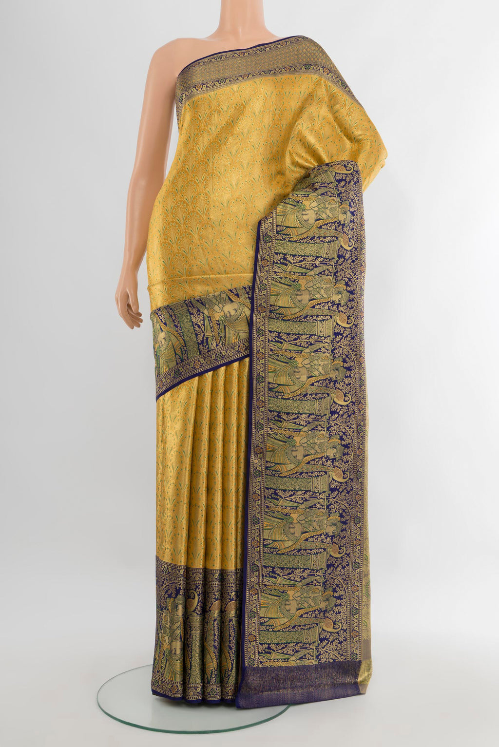 Golden Kanchipuram Tissue Silk Saree with Zari Brocade on the body and Zari Border.  displayed on a mannequin