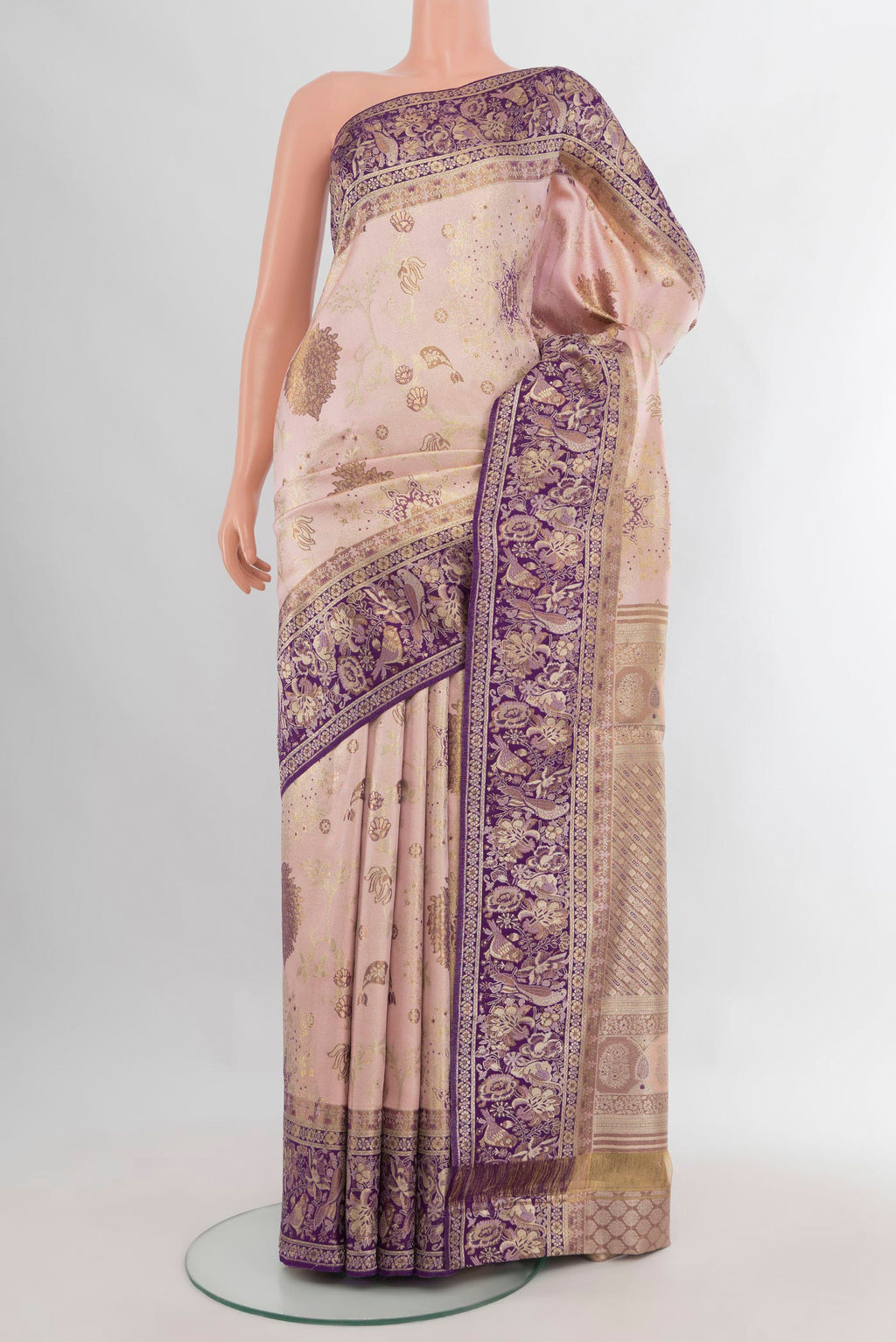 Pure Silk Rose Gold Kanchipuram Saree with Zari Brocade on the body and Zari Border.  displayed on a mannequin