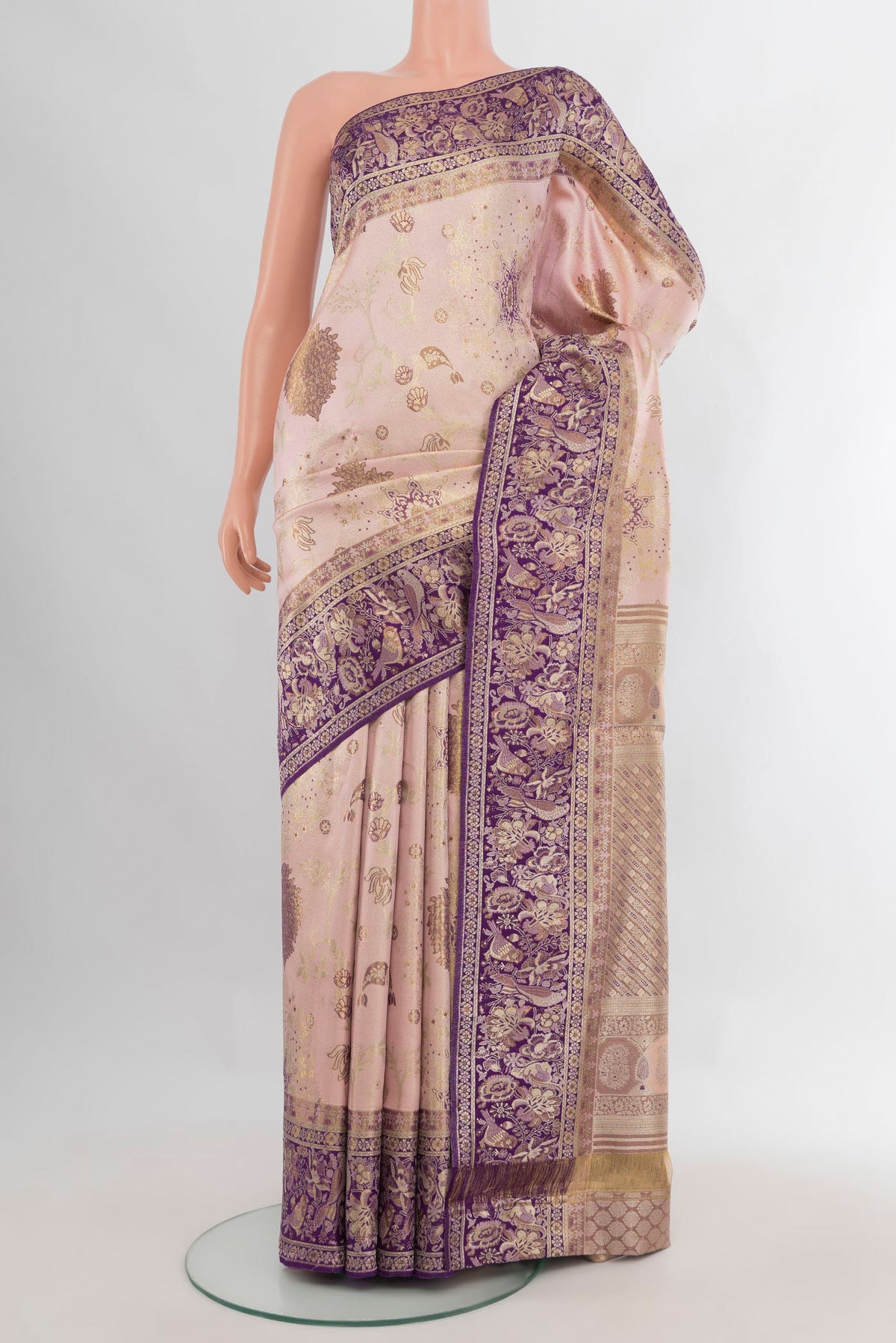 Pure Silk Rose Gold Kanchipuram Saree with Zari Brocade on the body and Zari Border.  displayed on a mannequin