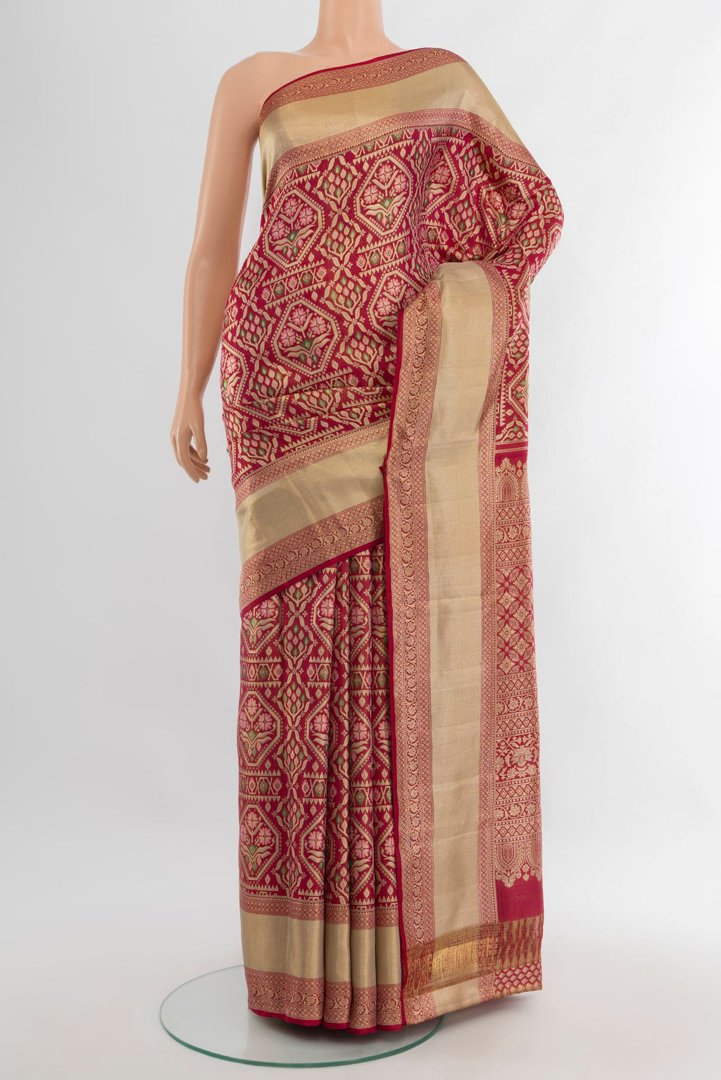 Maroon Kanchipuram Tissue Silk Saree with Zari Brocade on the body and Zari Border.  displayed on a mannequin
