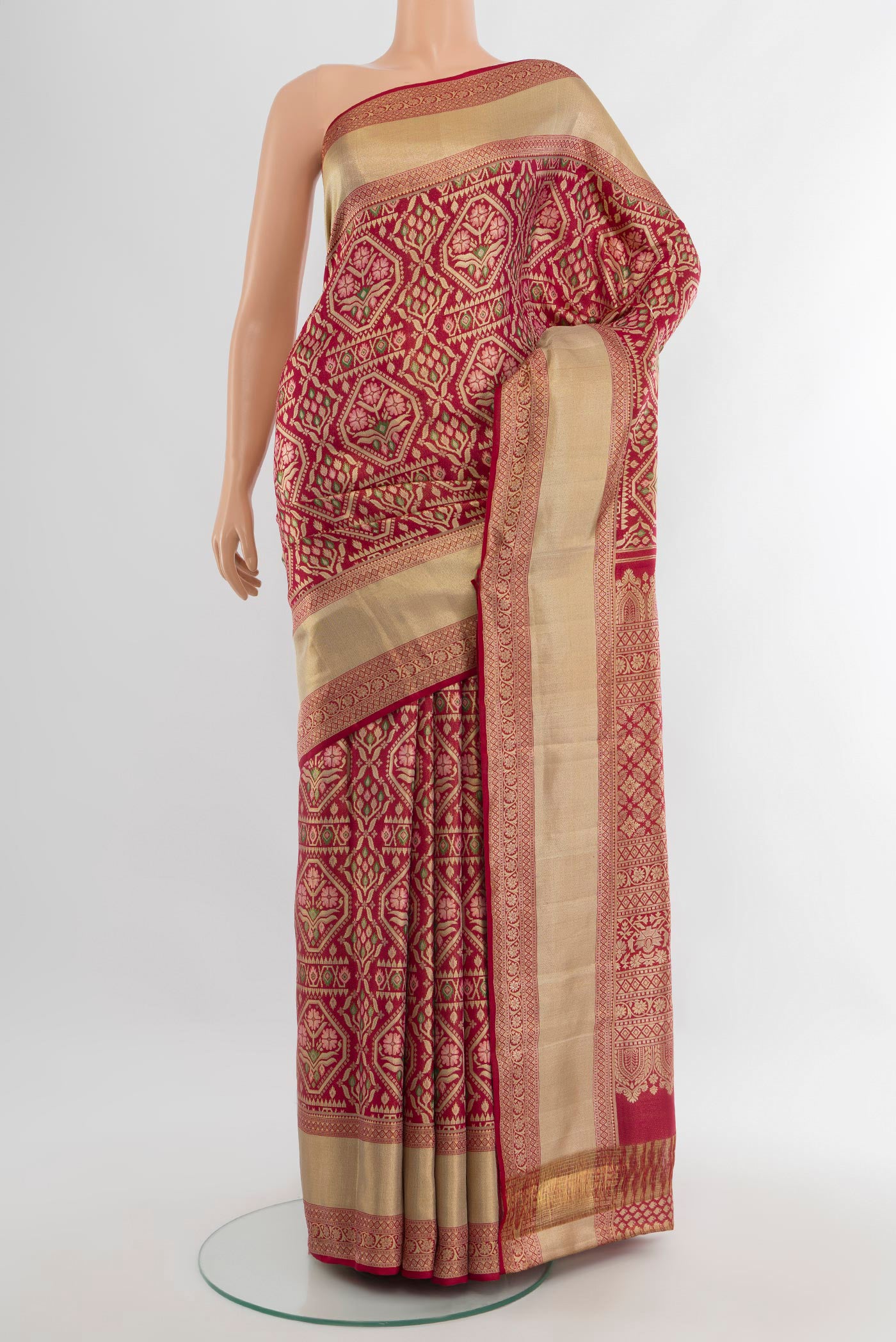 Maroon Kanchipuram Tissue Silk Saree with Zari Brocade on the body and Zari Border.  displayed on a mannequin