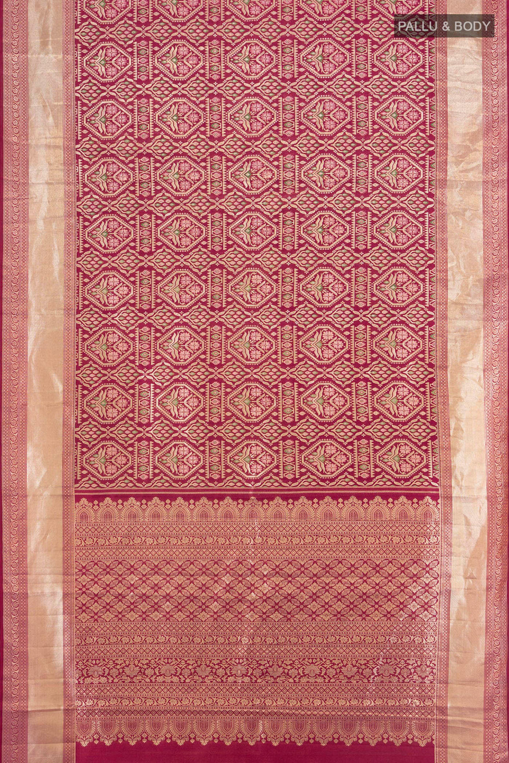Flat view of Maroon Kanchipuram Tissue Silk Saree with Zari Brocade on the body and Zari Border. 