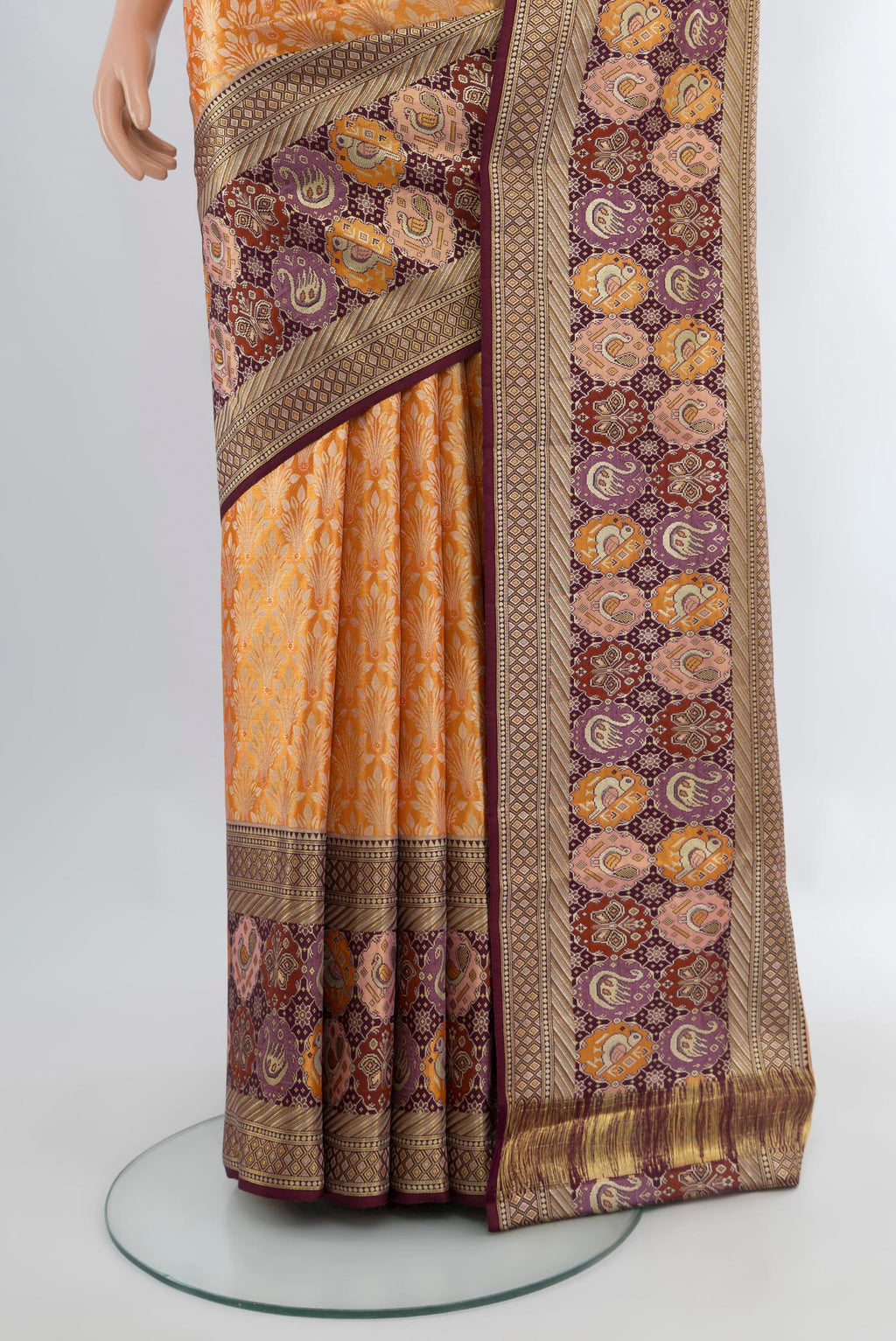 Pleats and pallu of Mustard Kanchipuram Tissue Silk Saree with Zari Brocade on the body and Fancy Border. 