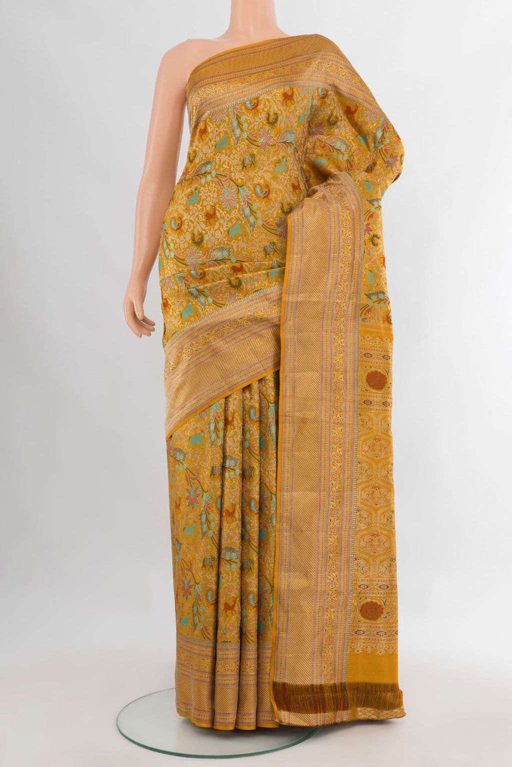 Pure Silk Mustard Kanchipuram Saree with Zari Brocade on the body and Zari Border.  displayed on a mannequin
