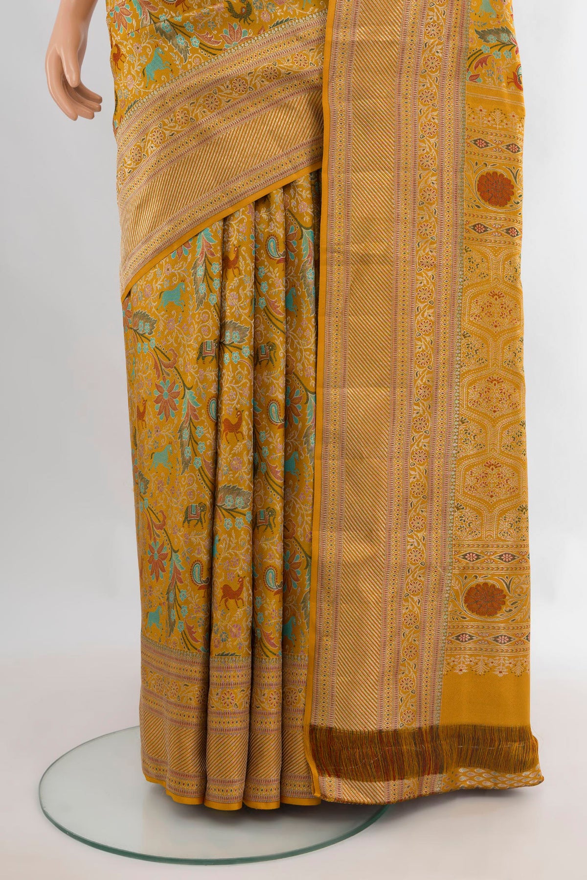 Pleats and pallu of Pure Silk Mustard Kanchipuram Saree with Zari Brocade on the body and Zari Border. 