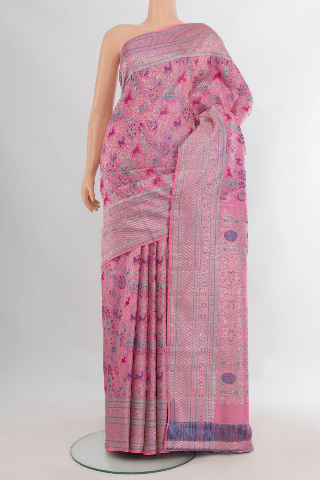 Pure Silk Rose pink Kanchipuram Saree with Zari Butta on the body and Zari Border.  displayed on a mannequin