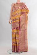 Pure Silk Yellow Kanchipuram Saree with Zari Brocade on the body and Zari Border.  displayed on a mannequin